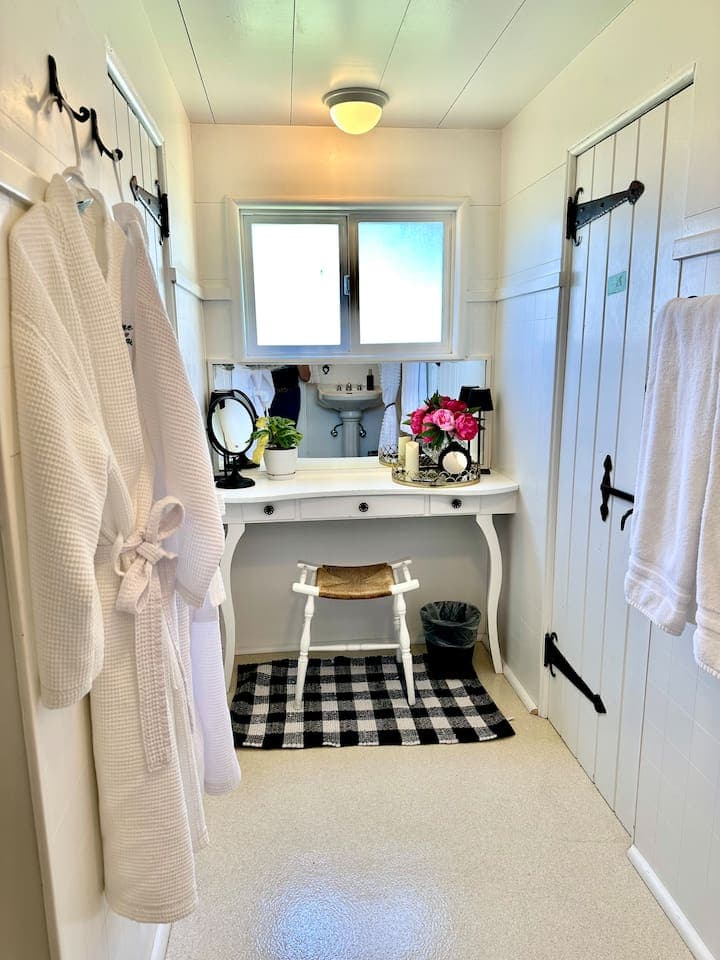 Charming Antique Dressing Table in King Suite Master Bath.  (Night Time View).  Get ready in this charming nook at a dressing table where guests have prepared for formal dinners since the 1930s!  *All original hardware has been preserved.
