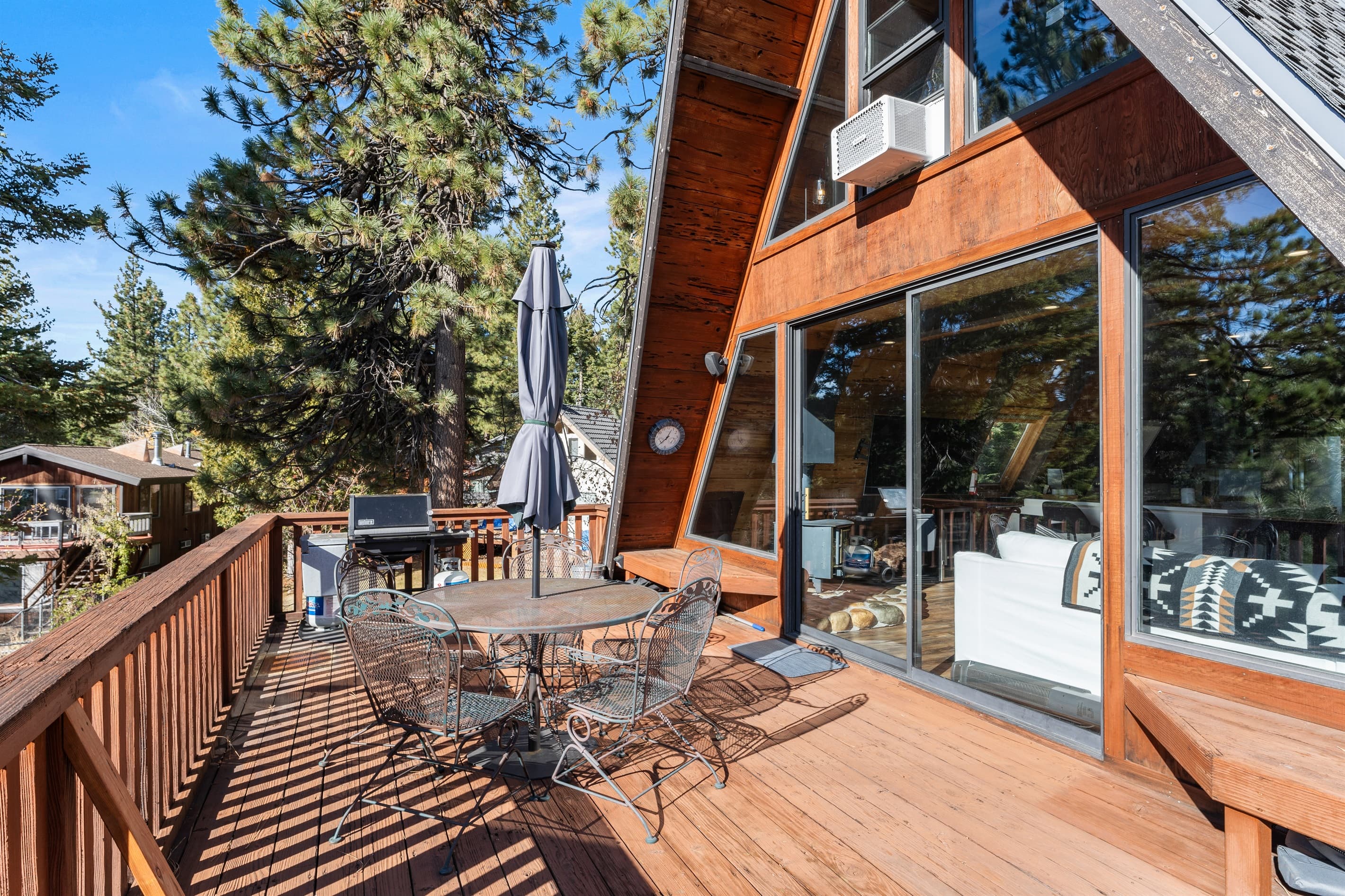 Soak up the sun from the back deck! Enjoy the private hot tub, patio table and BBQ grill. Plus there is a ping pong table underneath the deck.