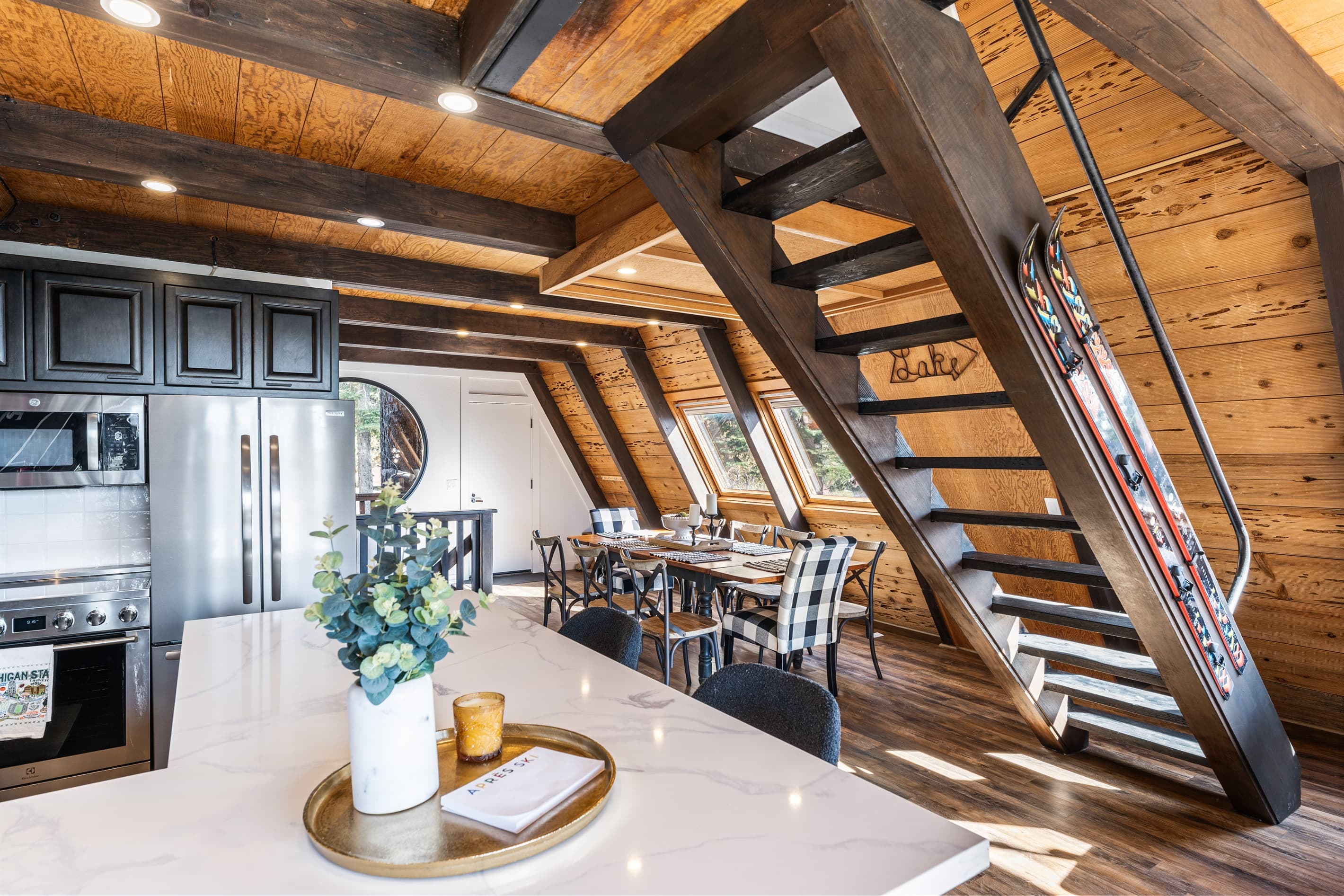 A chef's delight! The gourmet kitchen features sleek countertops, state-of-the-art appliances, perfect for meal prep or casual dining. Seating for 4 around the kitchen. A drip coffee maker is provided.