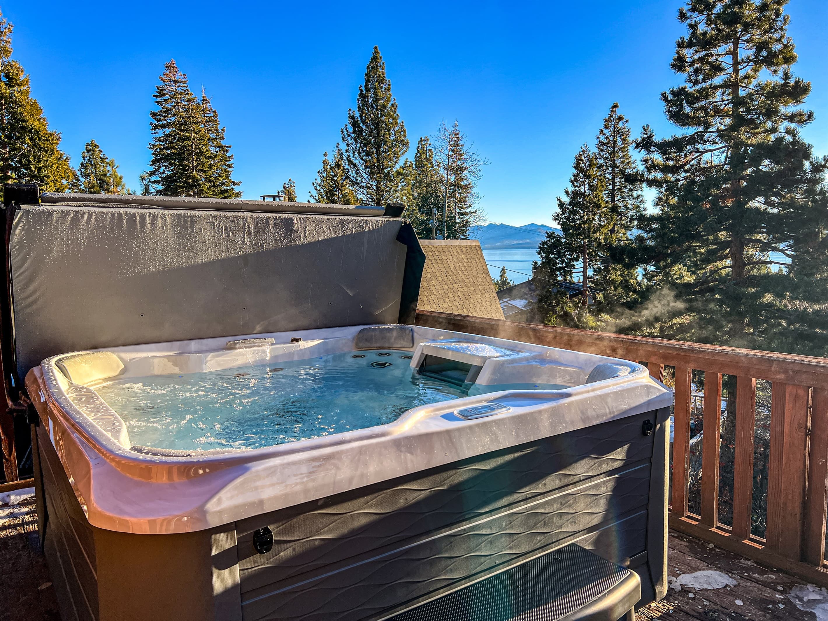 Soak up the sun from the back deck! Enjoy the private hot tub, patio table and BBQ grill. Plus there is a ping pong table underneath the deck.