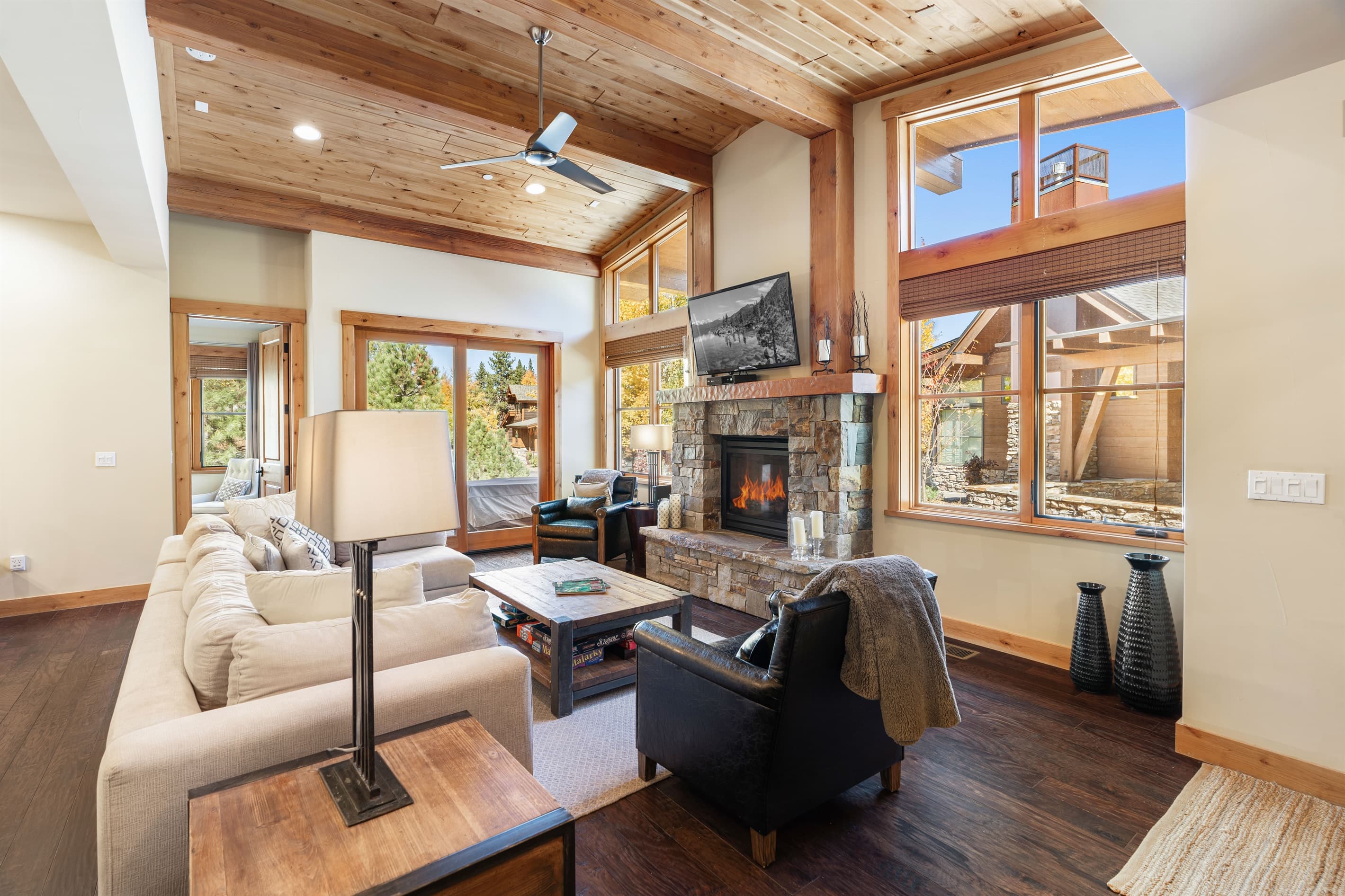Relax in the inviting great room, where soaring ceilings and large windows flood the space with natural light while framing the picturesque mountain scenery. Cozy up by the stone fireplace and enjoy the 50" TV.