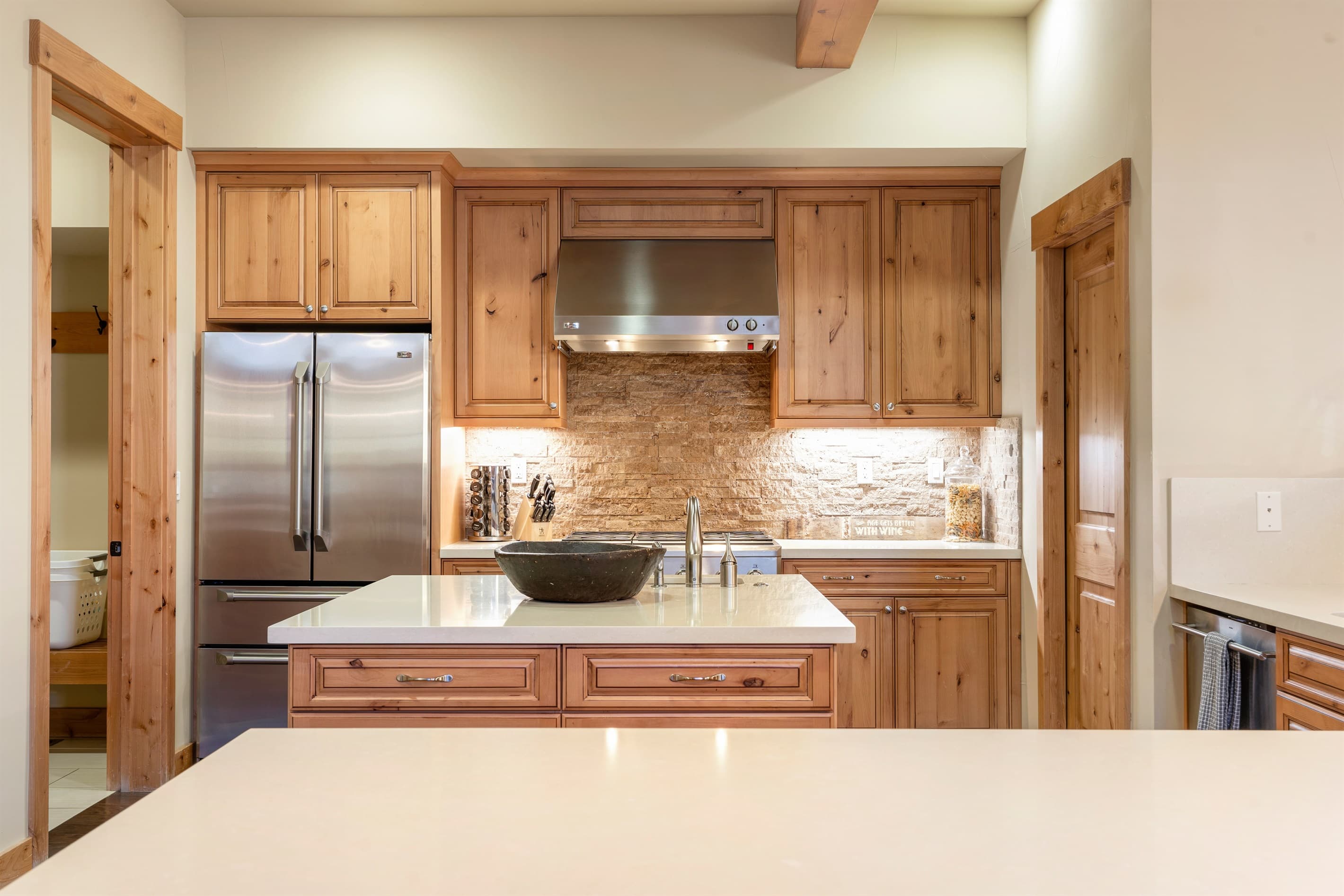 A chef’s dream kitchen with sleek countertops, premium appliances, and a spacious island ideal for cooking, gathering, and casual meals. Countertop seating for 3 people.