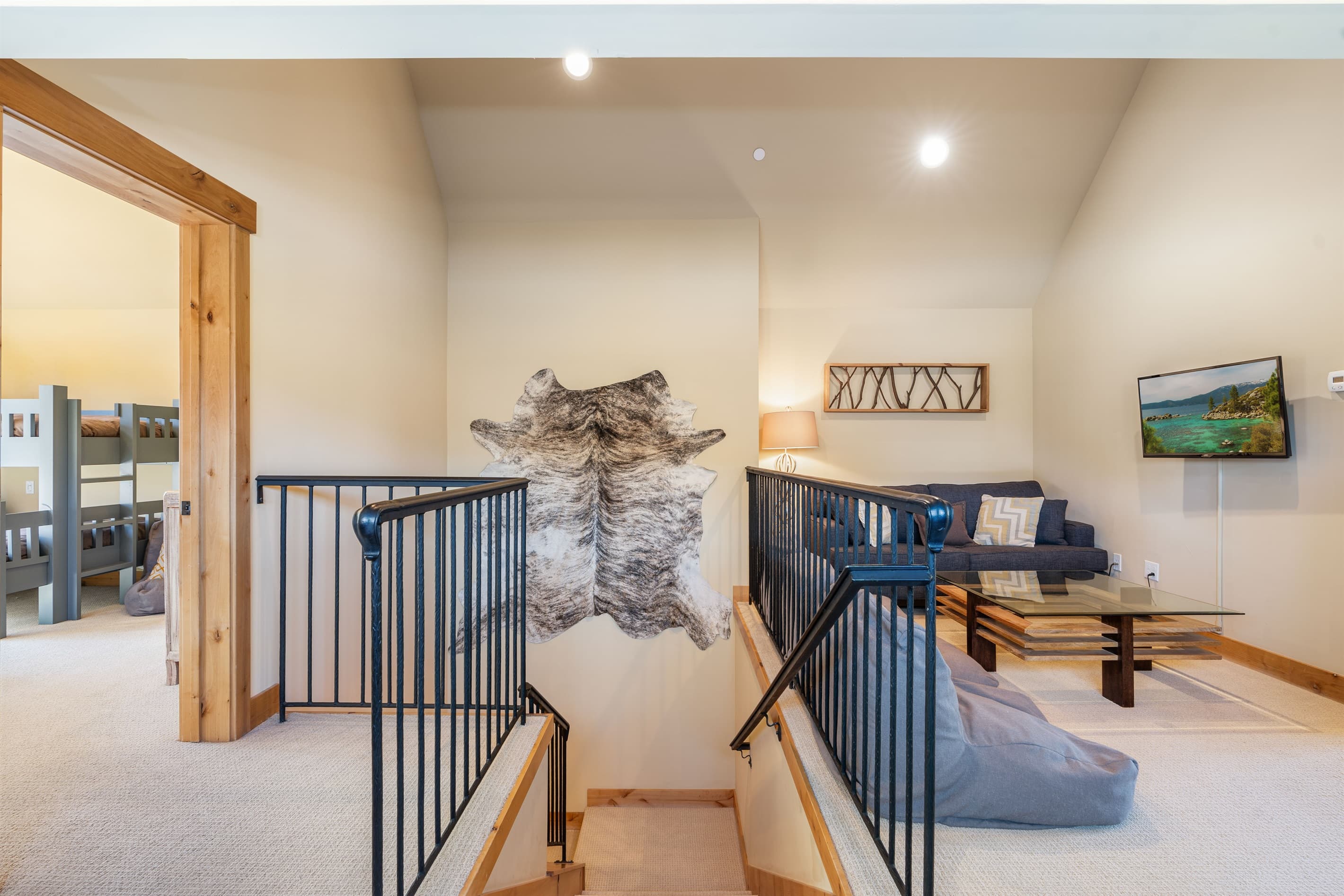Unwind in the upstairs loft, complete with a TV, bean bag chairs, and a pullout couch for extra comfort and flexibility.