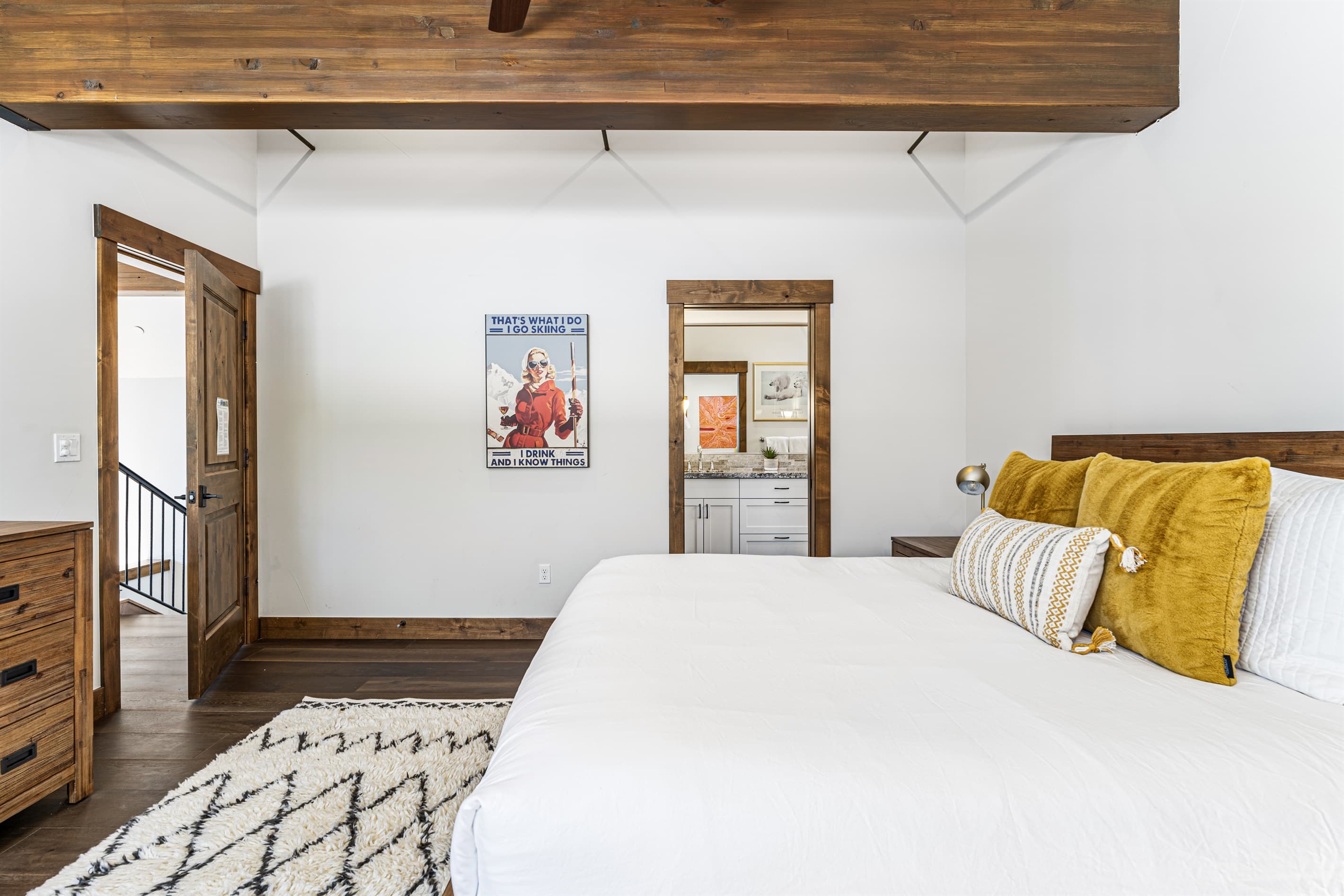 The luxurious master suite boasts a plush king bed and an en-suite bathroom, making it a serene retreat after a day of Tahoe adventures.