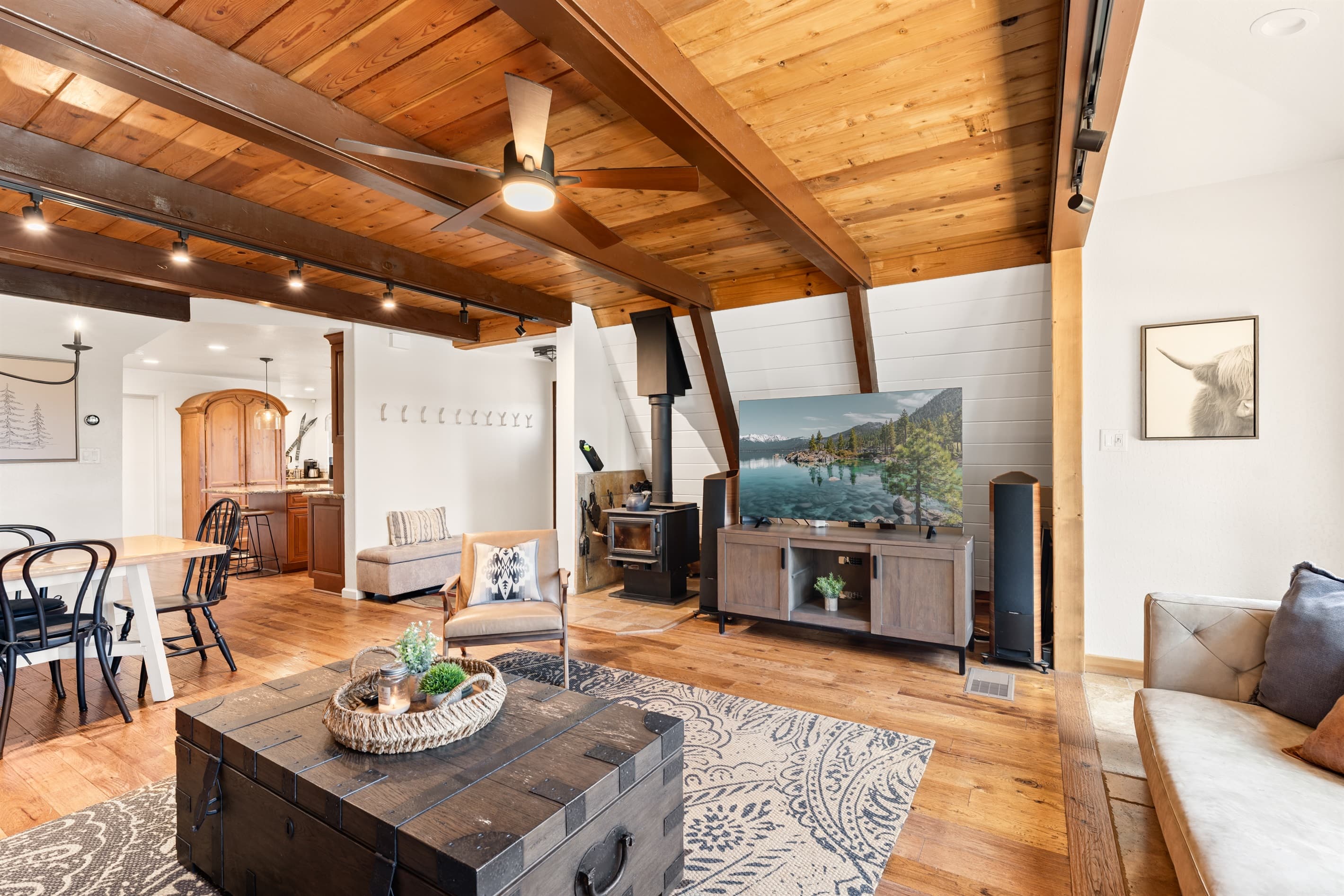 Cozy up in the heart of the home, floor-to-ceiling windows, 65" Smart TV and a wood-burning fireplace set the mood for your mountain escape. Whether it’s morning coffee or après-ski wine, this is the place to be.