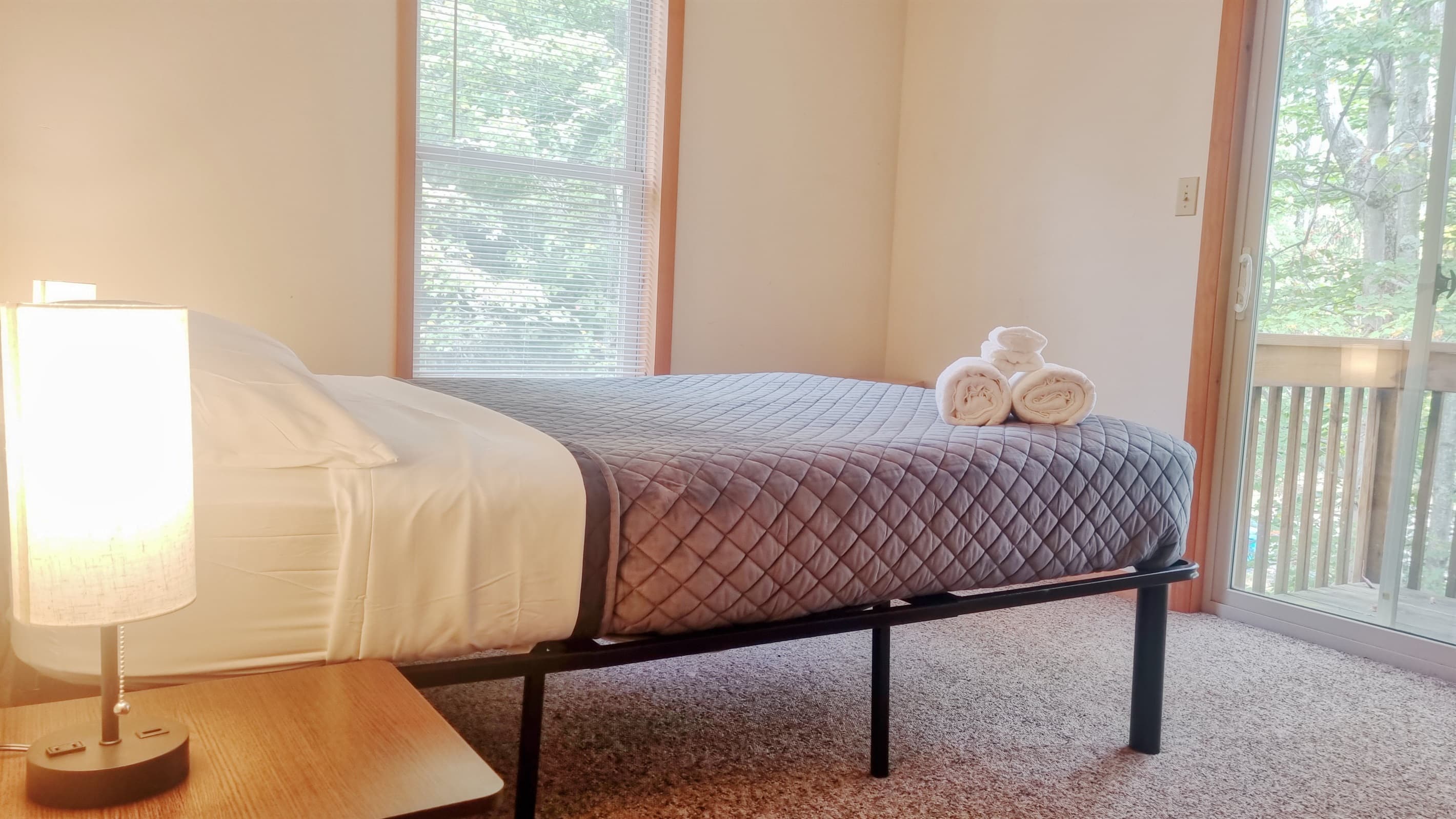 Bedroom 2 with queen bed and balcony