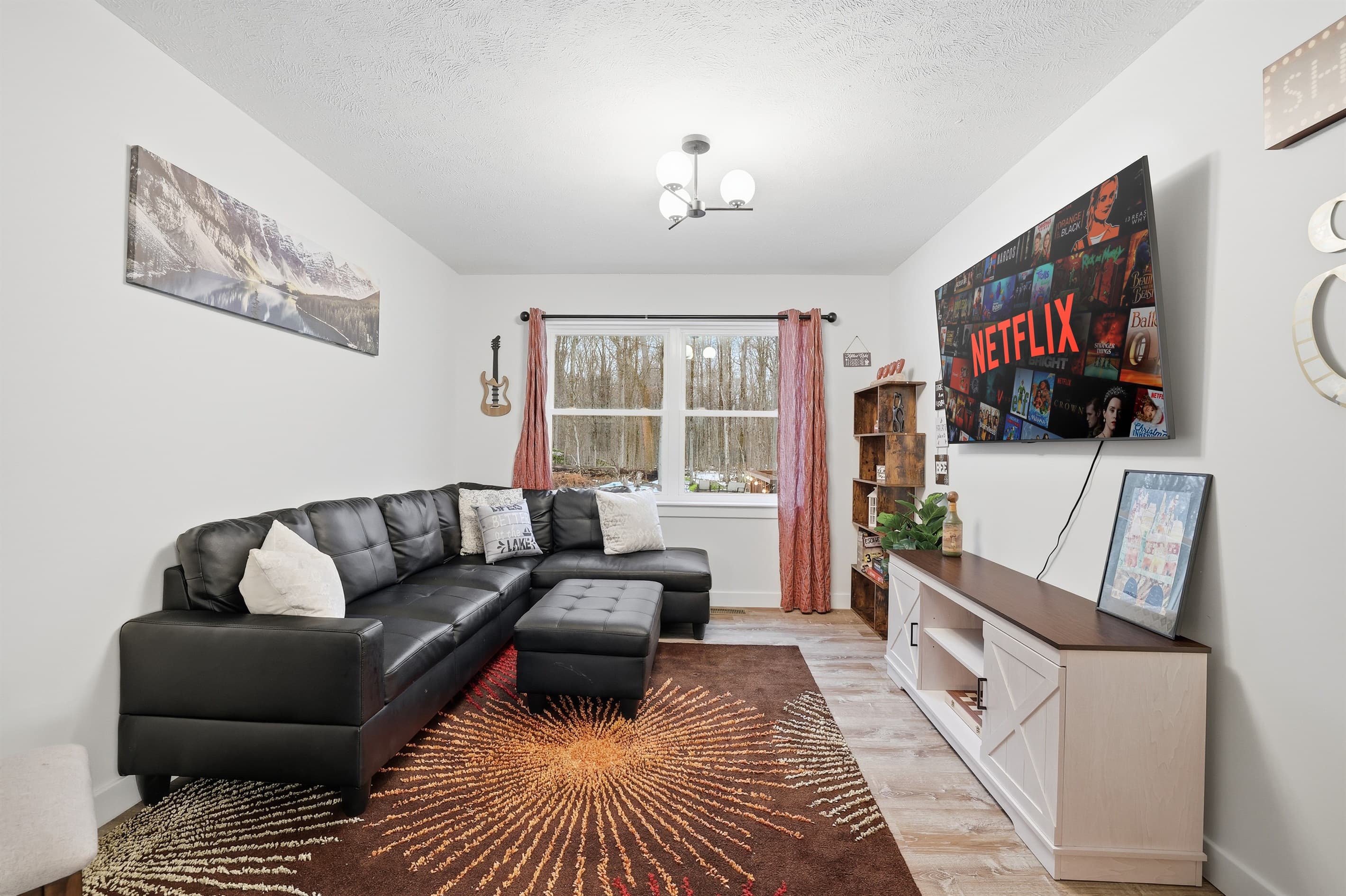 Room with comfy couch and TV