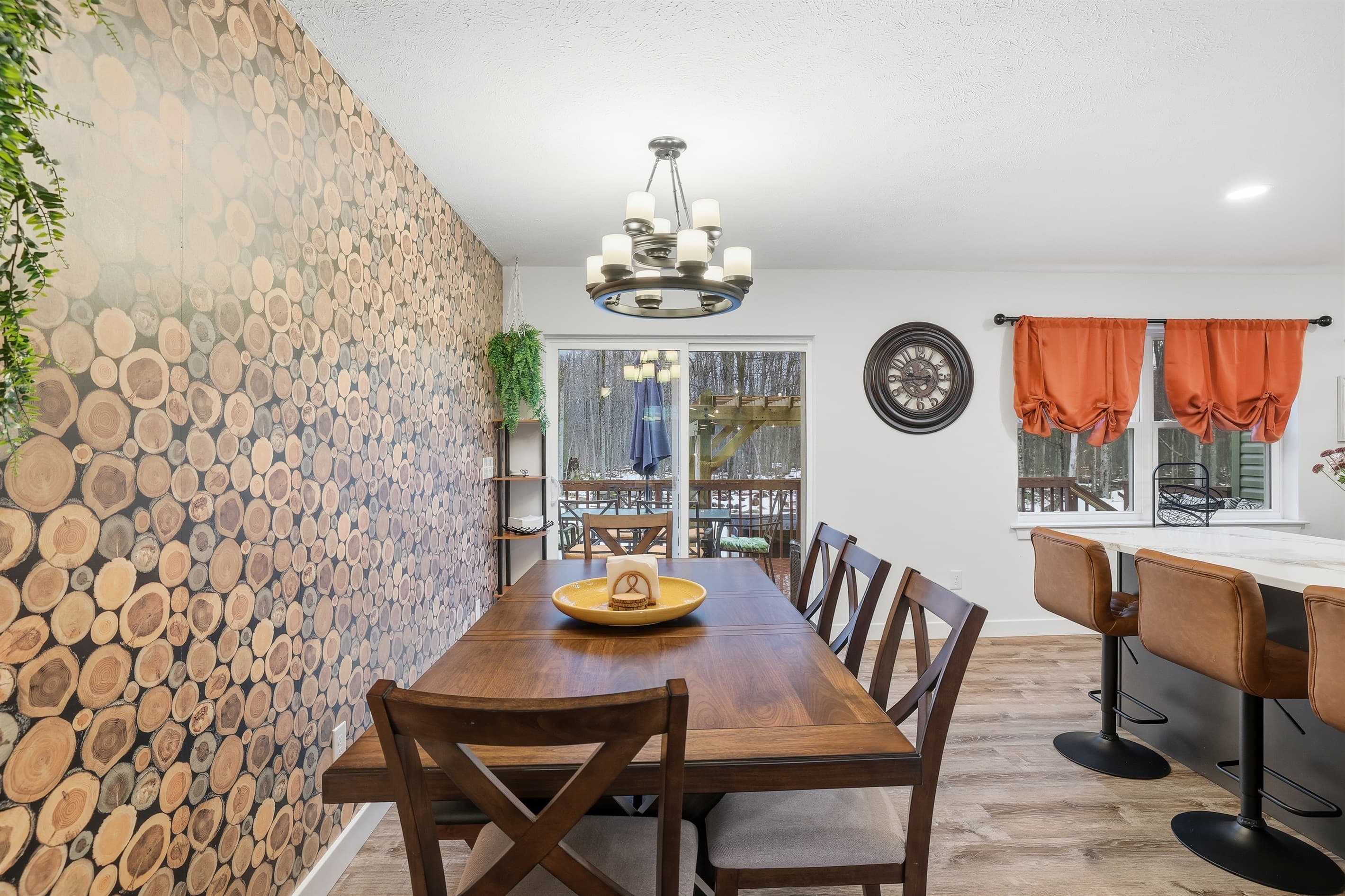 Fully stocked kitchen with stainless steel appliances, quartz countertop and a breakfast and dining area