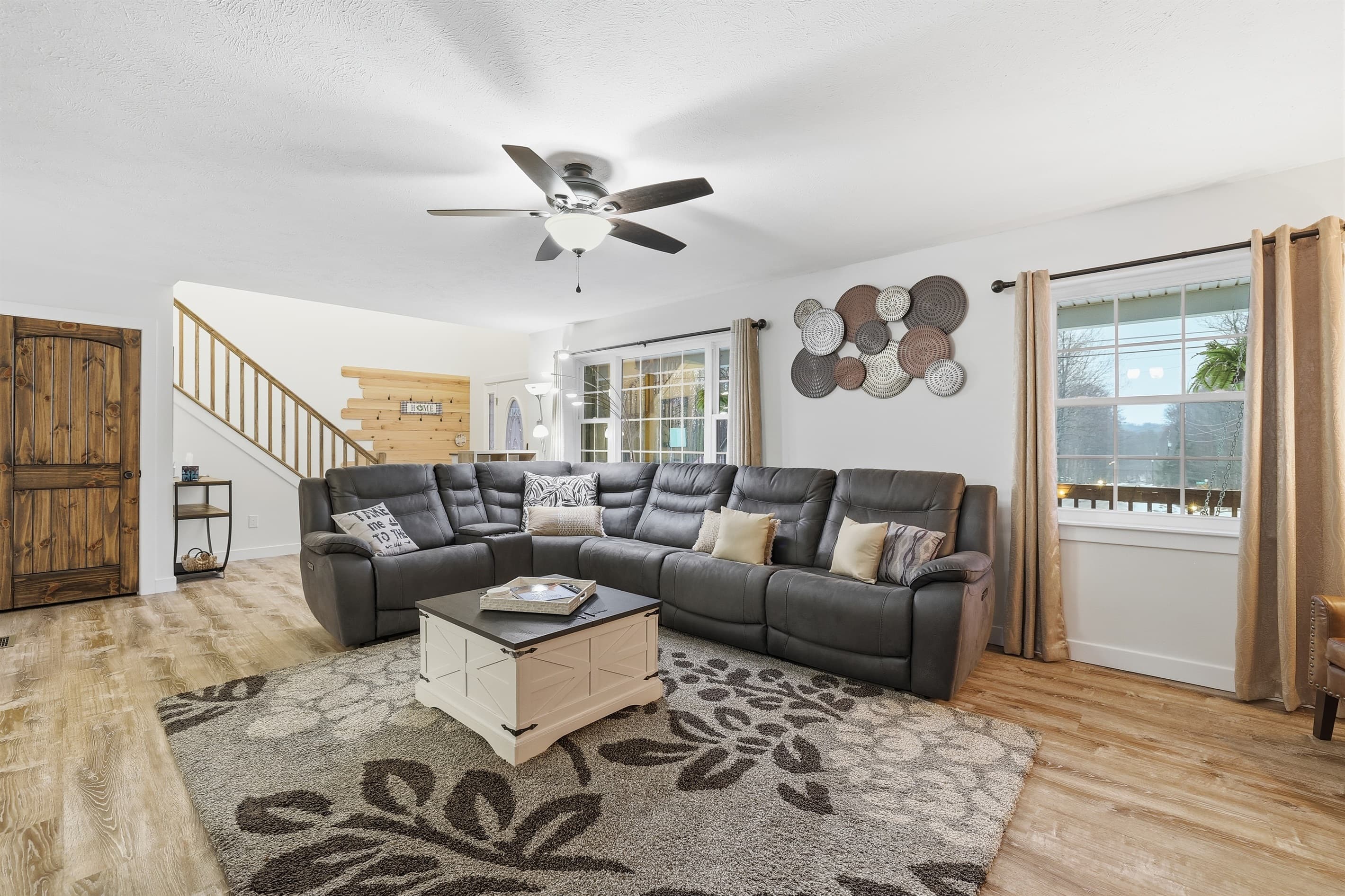 Living room with smart TV, fireplace and comfortable couches