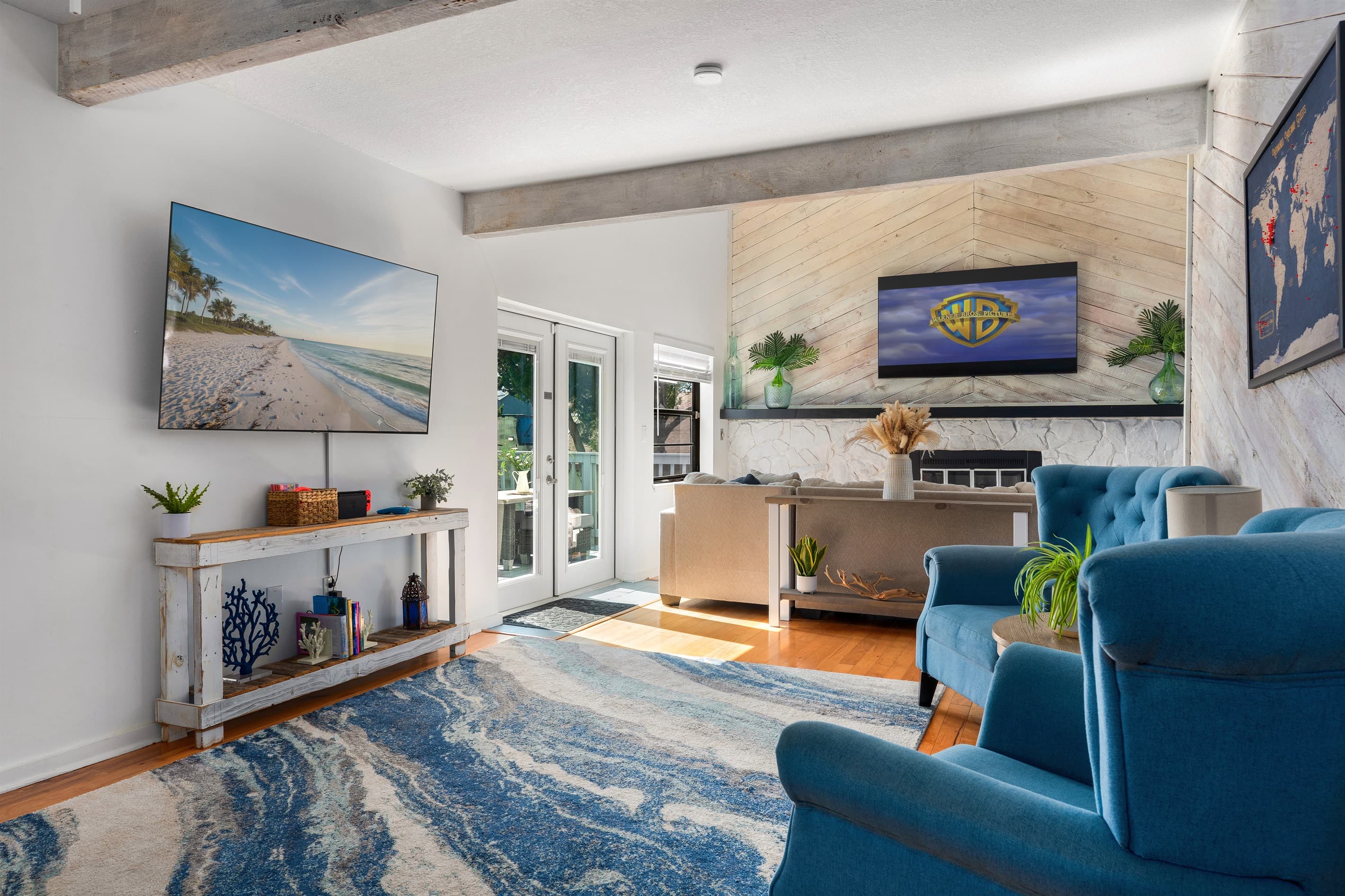 Bright, open living-unwind together after a beach day with 75” & 65"  Smart TV. 
