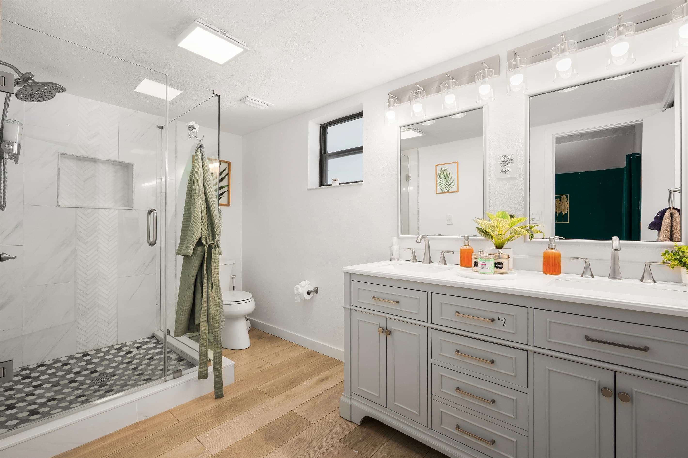 Spa-style ensuite primary bathroom double vanity and walk-in shower.