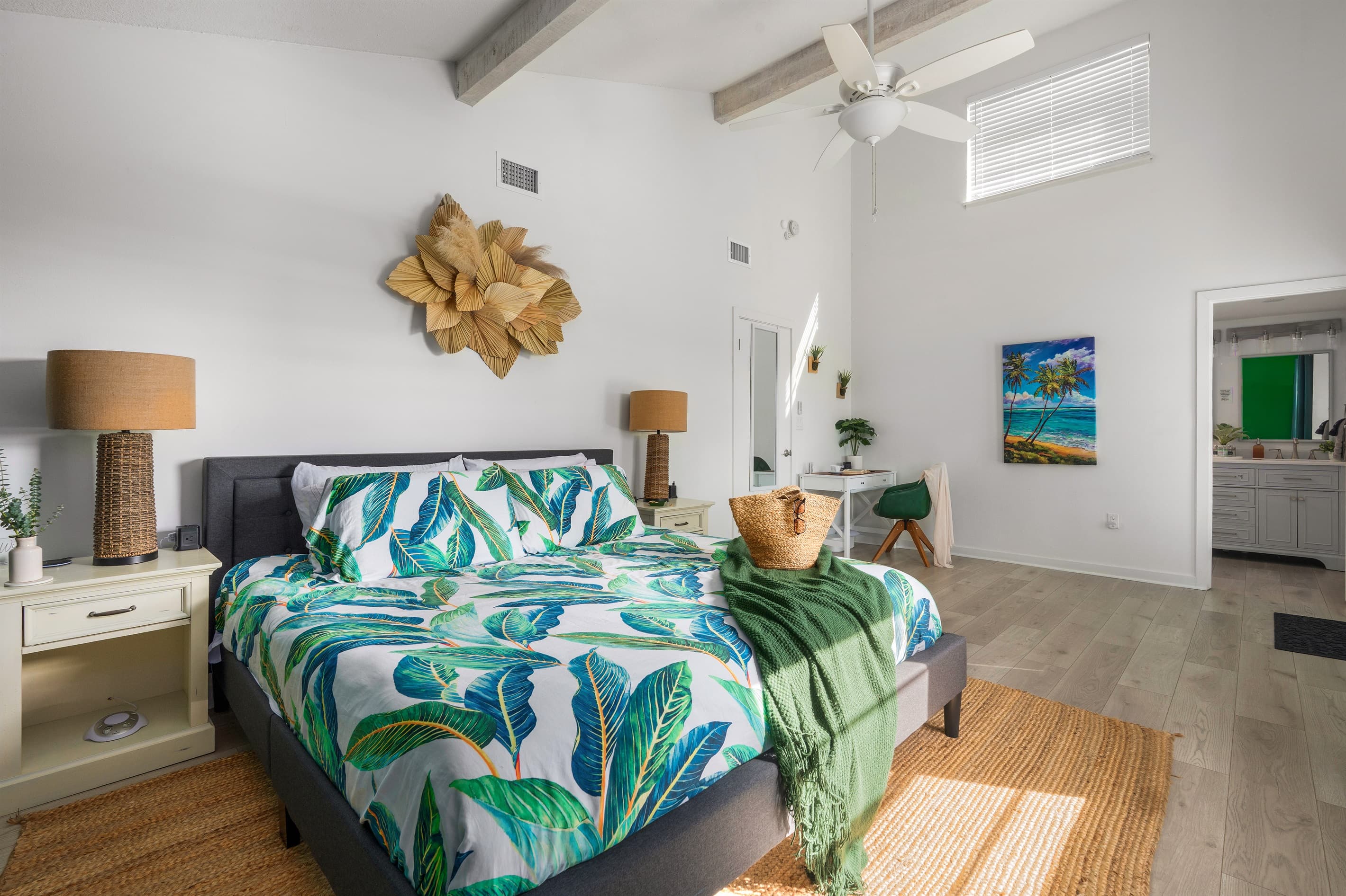 Spacious primary suite with king bed, workspace, and private ensuite.