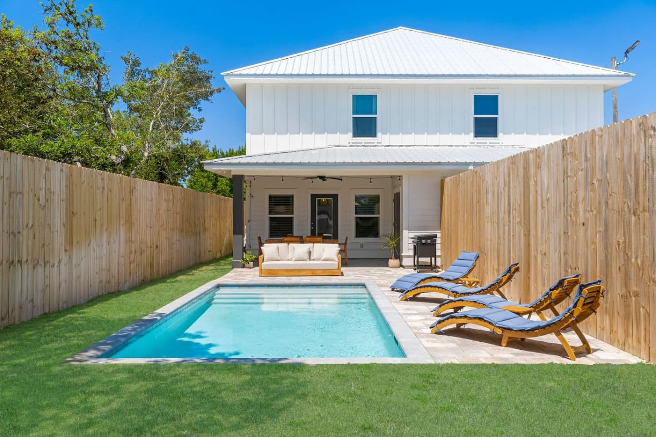 A spacious backyard to enjoy the pool, the sun or grilling out