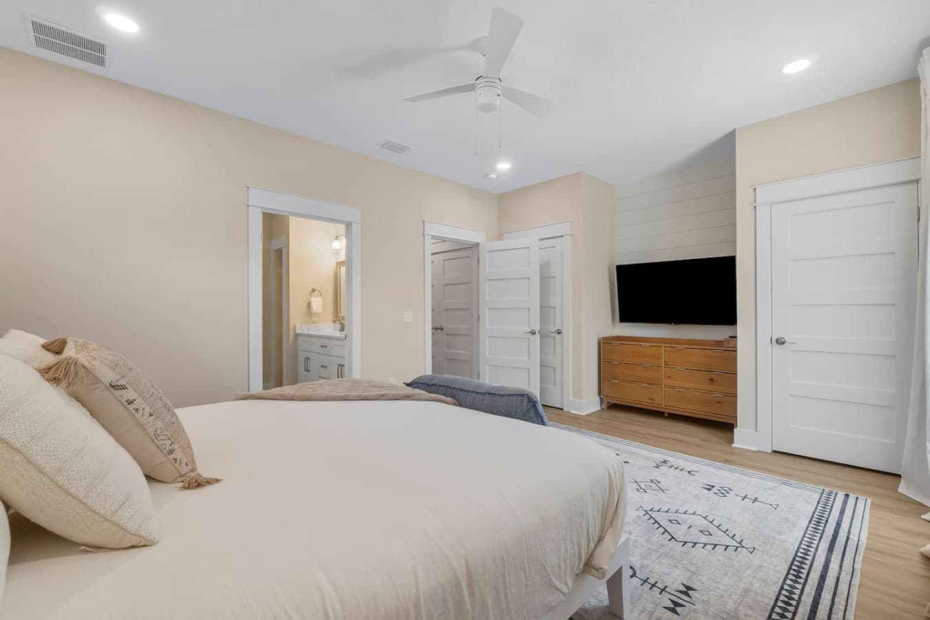 King Bedroom Upstairs with 65 inch smart TV