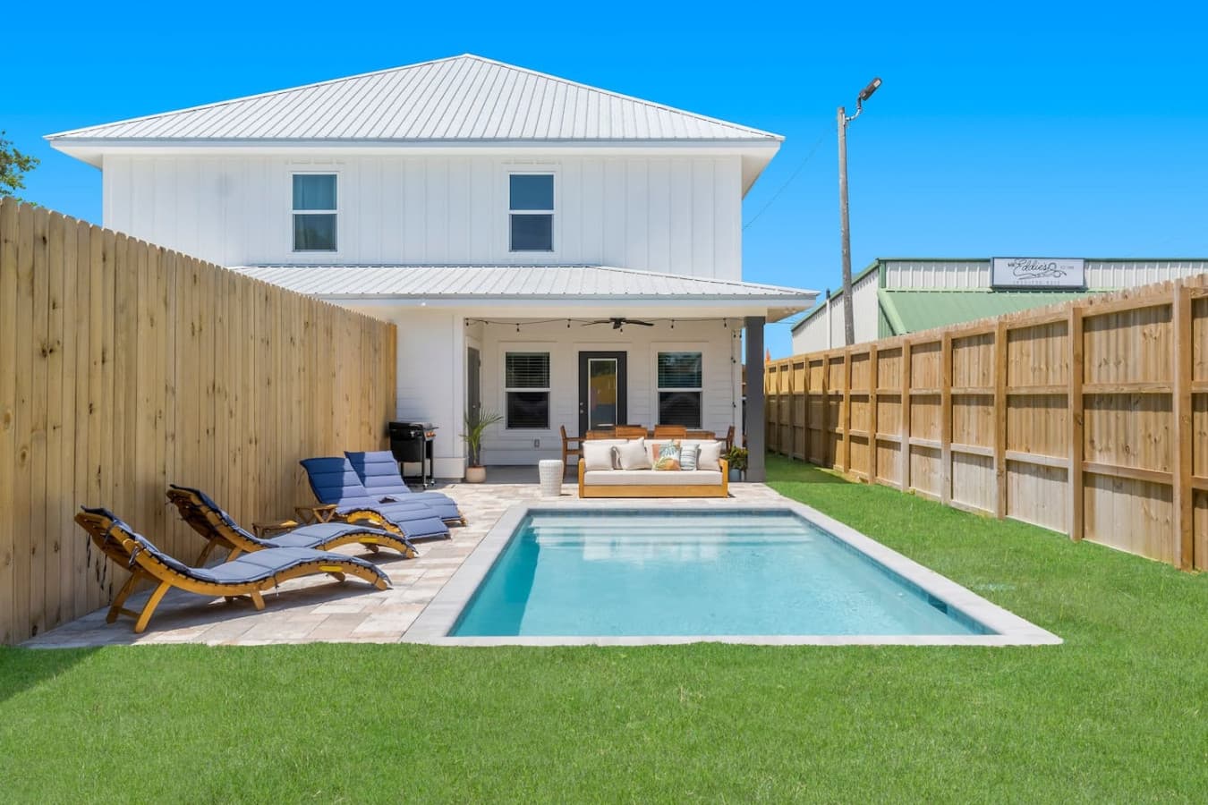A spacious backyard to enjoy the pool, the sun or grilling out