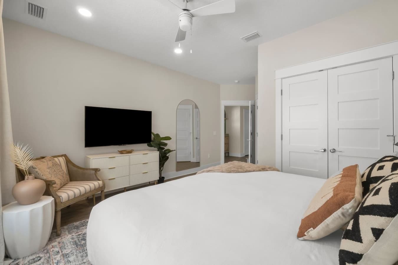 A large smart TV accompanied in the bedroom