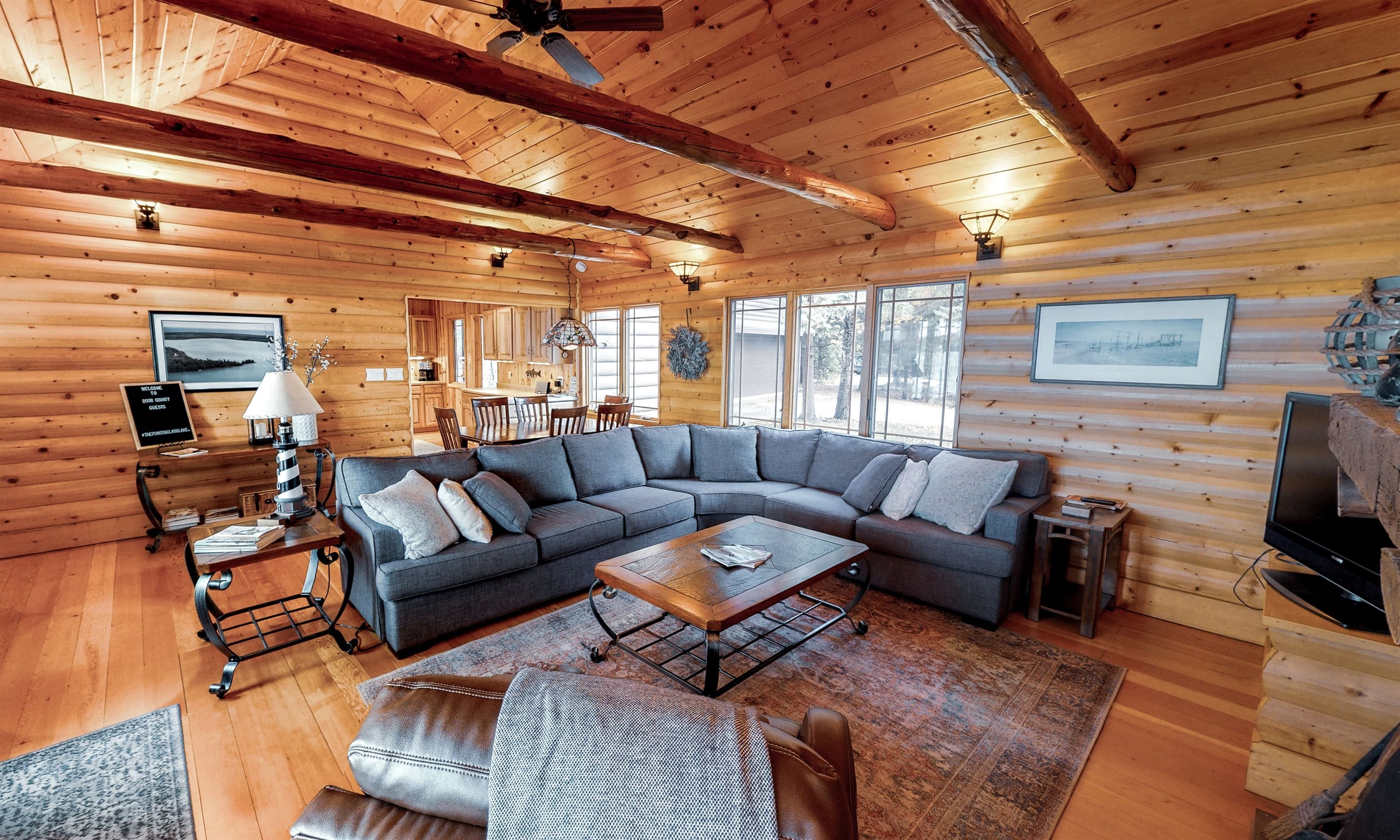 Vaulted ceilings and a pullout couch in the living room make this an additional sleeping area if needed.