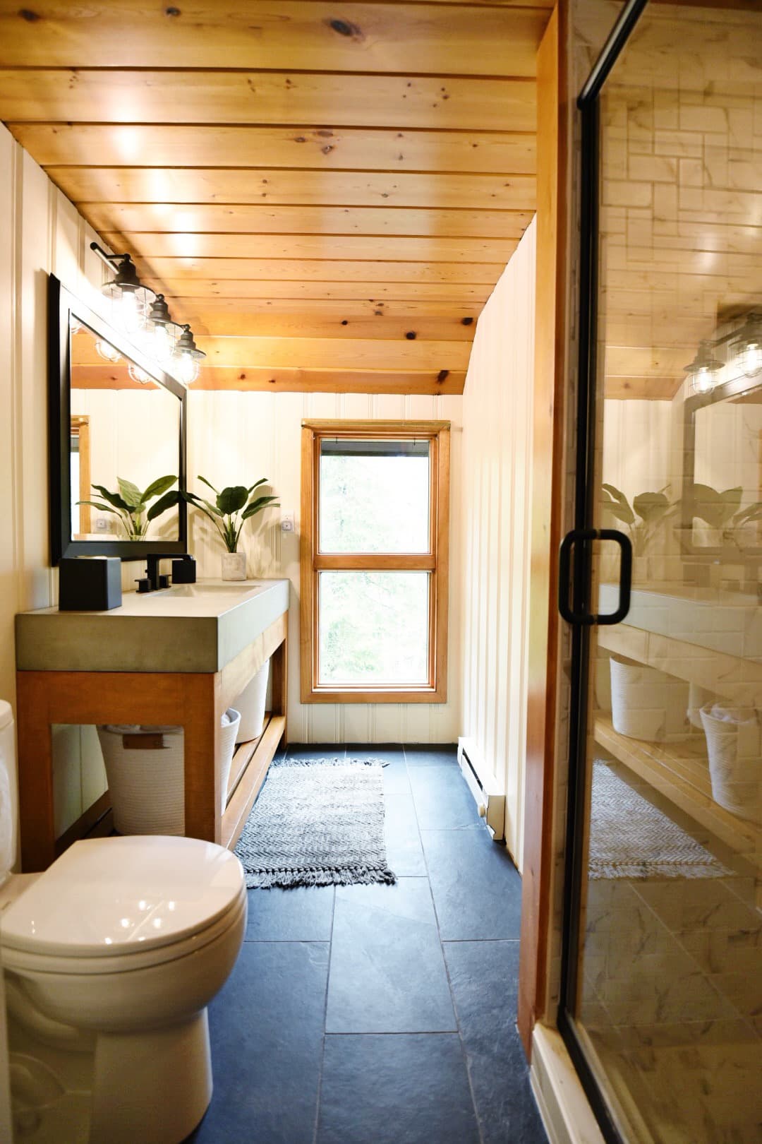 Modern updated bathroom with concrete sink.
