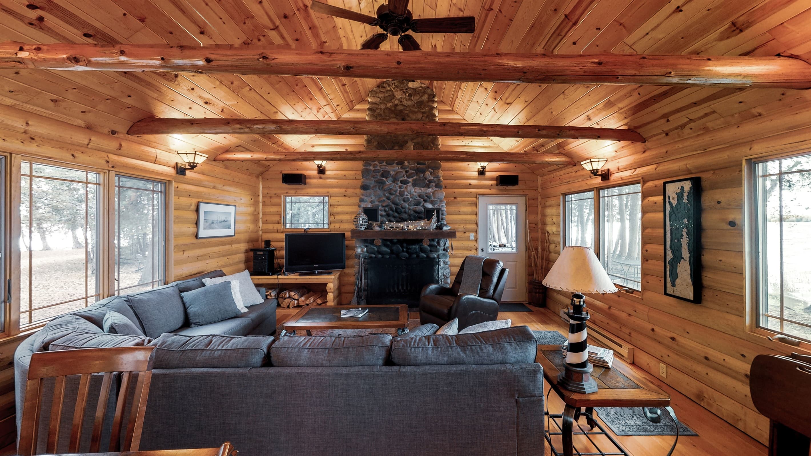 Another view of the fireplace and perfect spot for a movie night after a day on the lake!