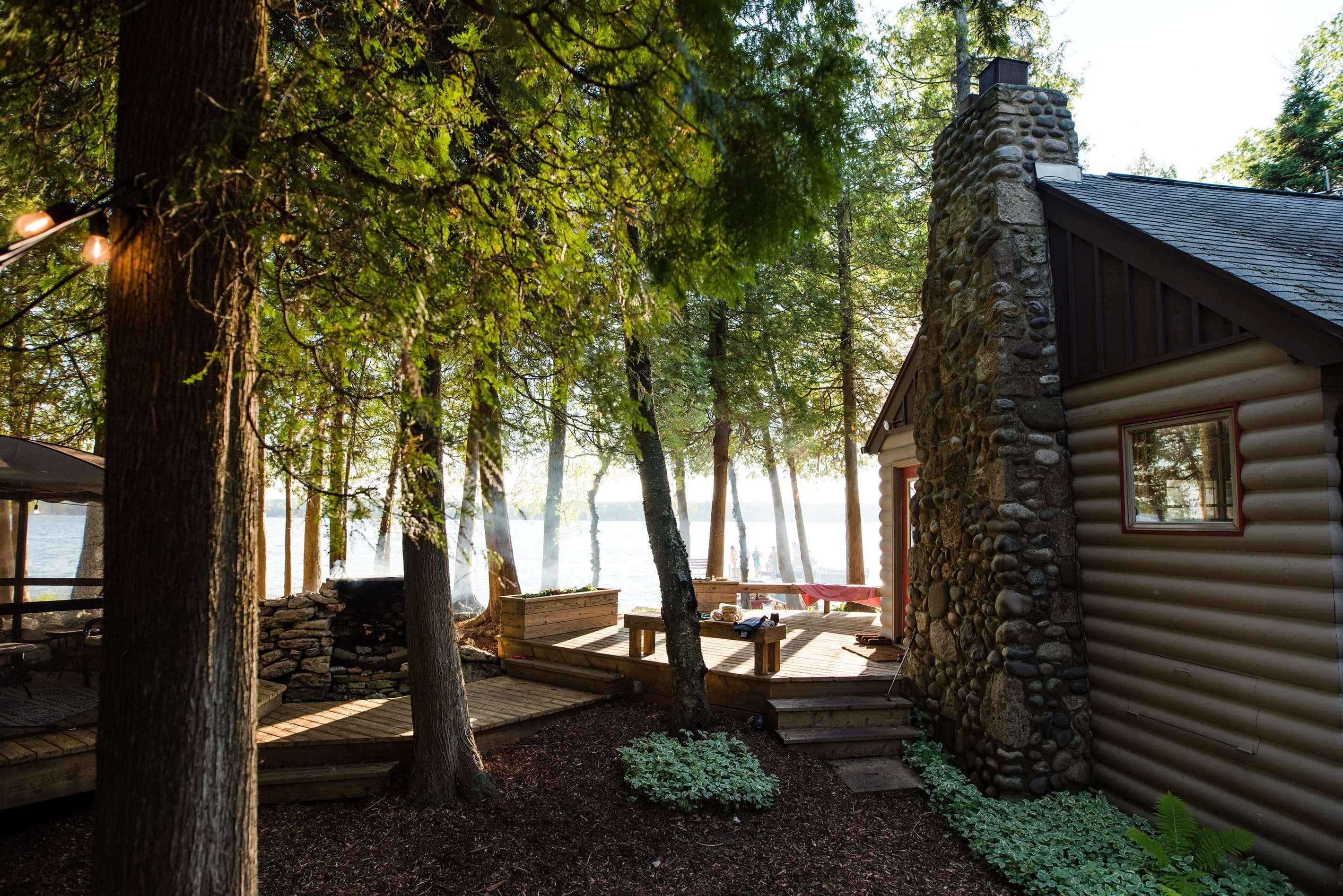 Panoramic view of the outdoor expansive deck offering so many wonderful places to congregate and enjoy the lake and outdoors.