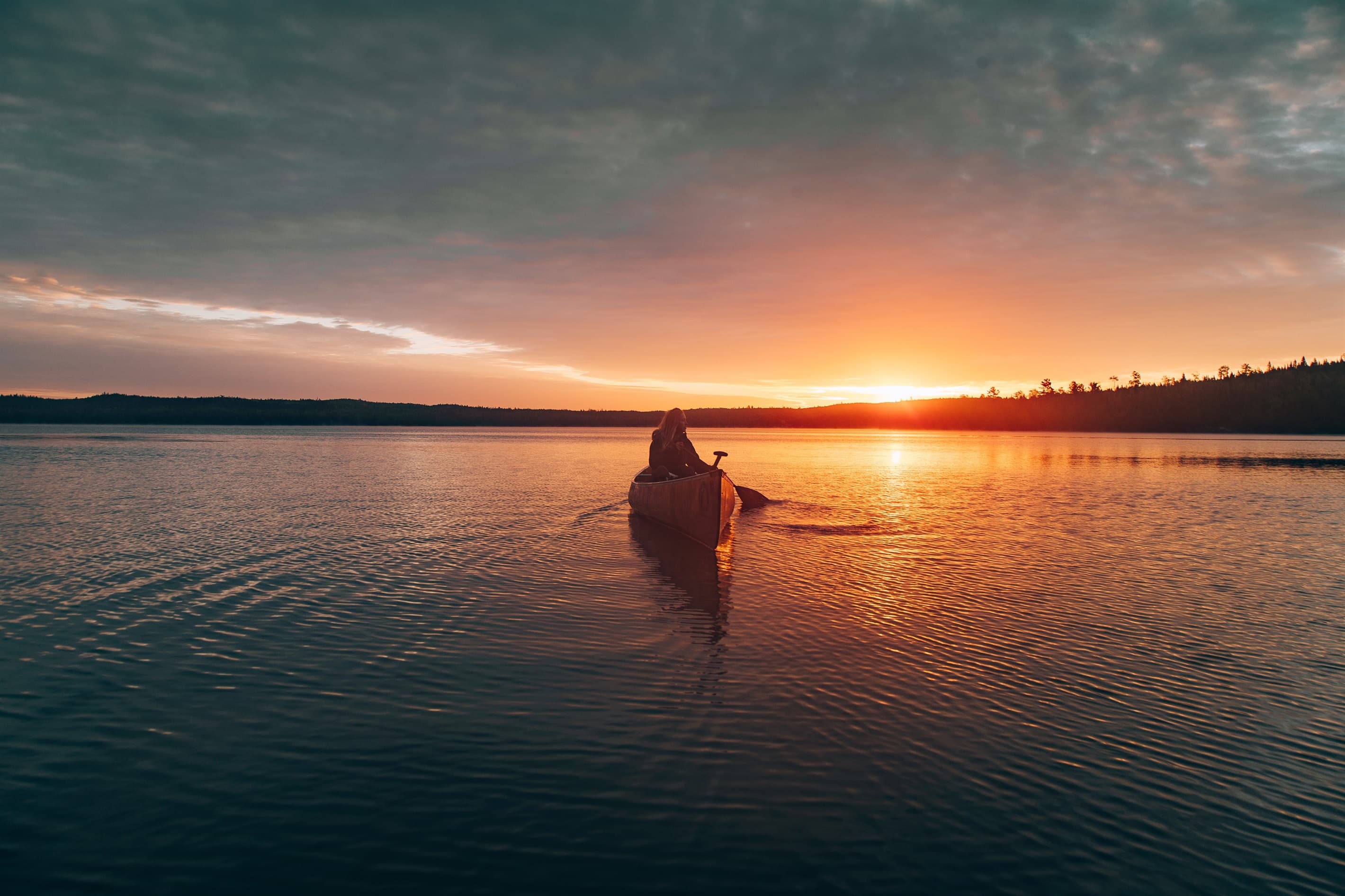 Canoes ready and waiting for you to enjoy a sunset from the water.