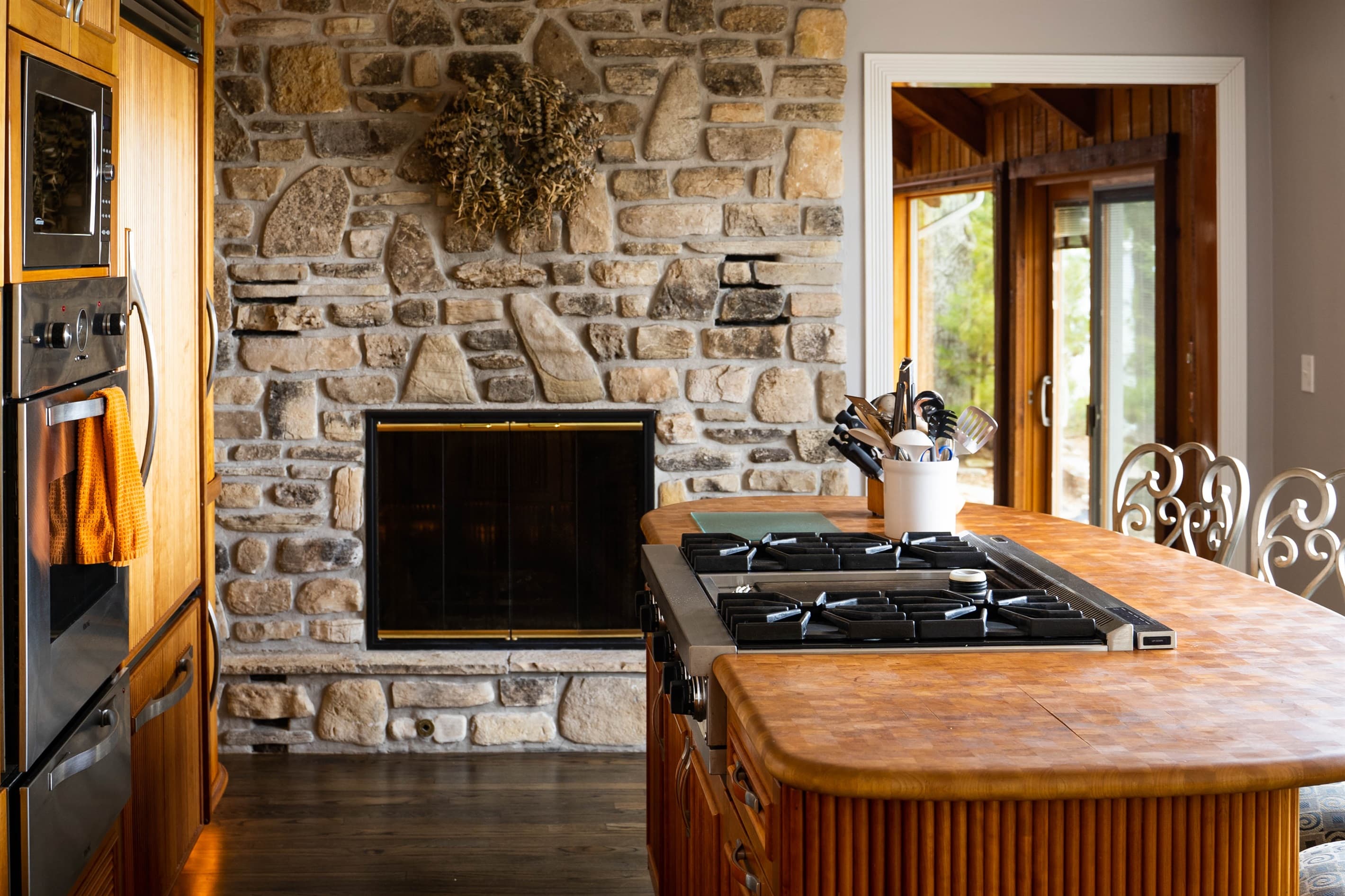Full kitchen with a wood burning fireplace