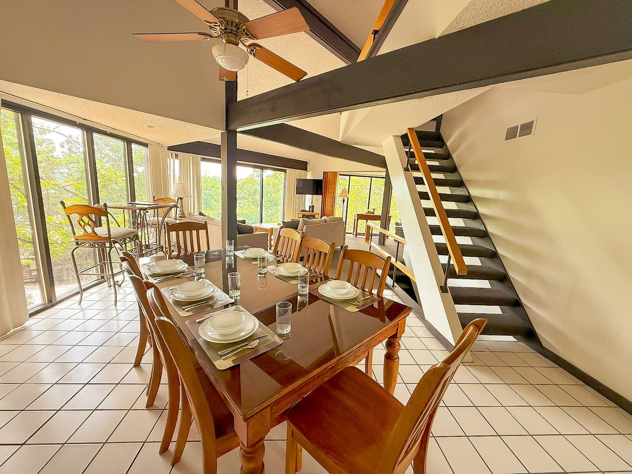 "Spacious and bright! This dining area provides ample seating for your group, with easy access to the kitchen and living spaces for a seamless flow."