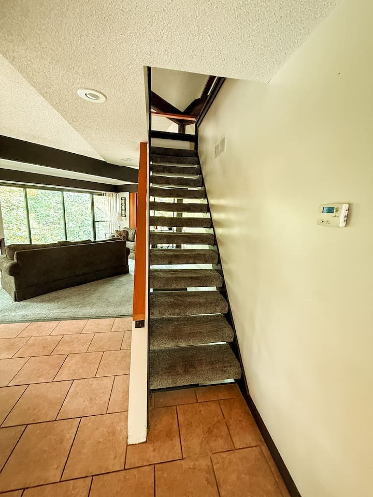 "Welcome inside! This inviting entrance leads you directly into the cozy living space of your Treetop Village getaway."