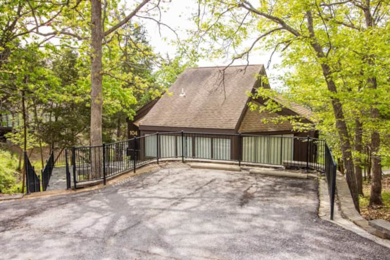 "Discover the peaceful setting of Treeloft Villa 104, blending harmoniously with the lush surroundings of Treetop Village."