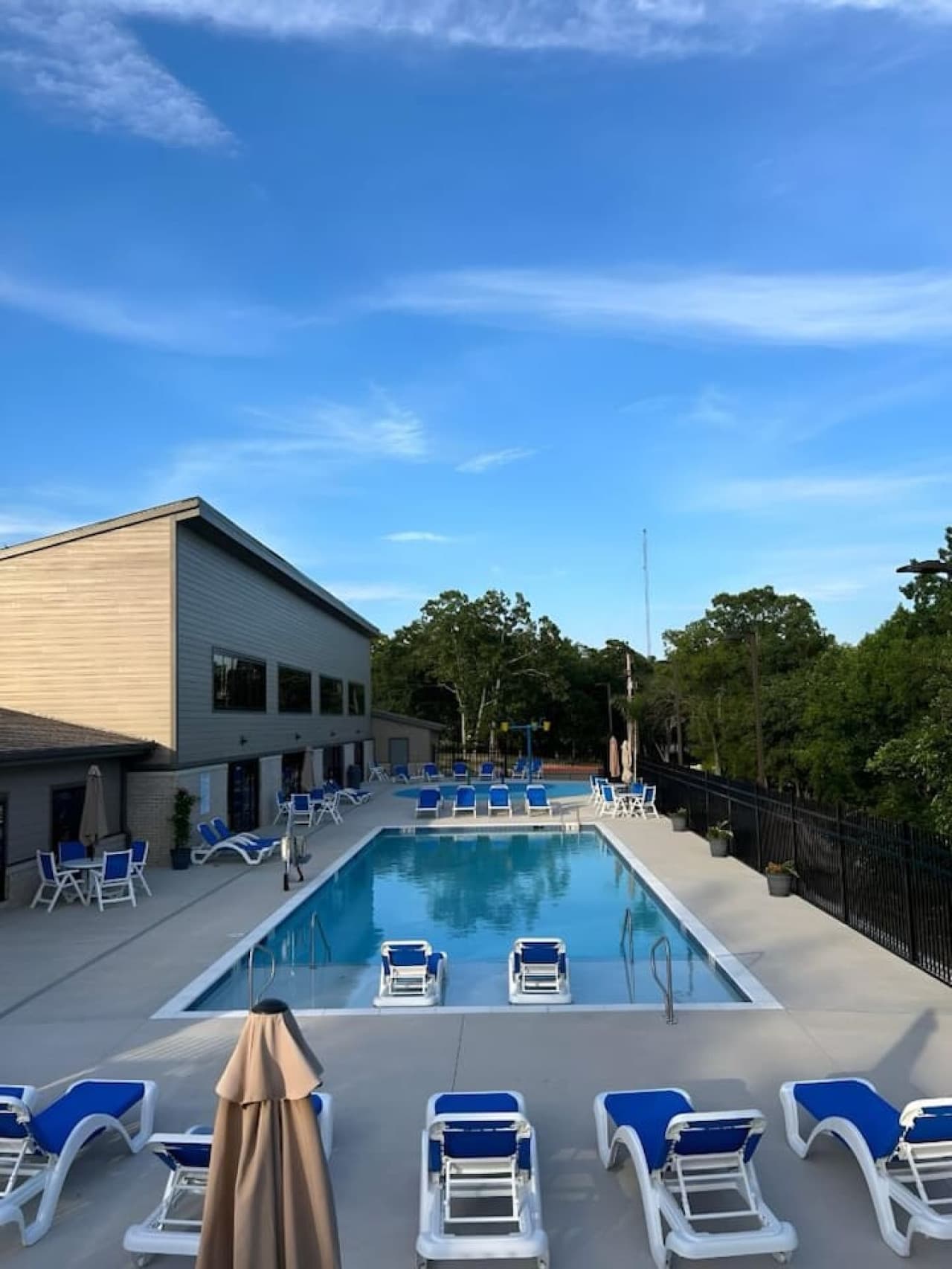 "Soak up the sunshine at our vibrant outdoor pool complex, complete with plenty of loungers for ultimate relaxation."
