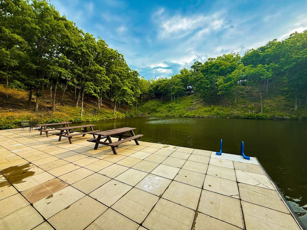 Community swim and fishing dock with picnic area – all units are hillside-style with no direct water access. Boat or jet ski slips available to rent by the day or week.
