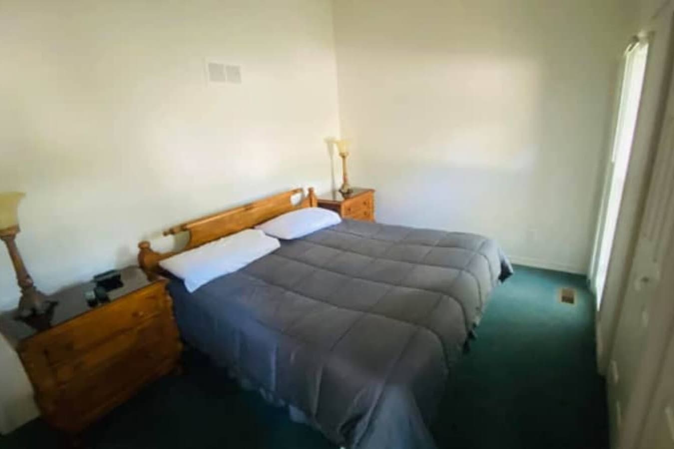 Wake up refreshed in this inviting bedroom, designed for comfort after a day on the lake.