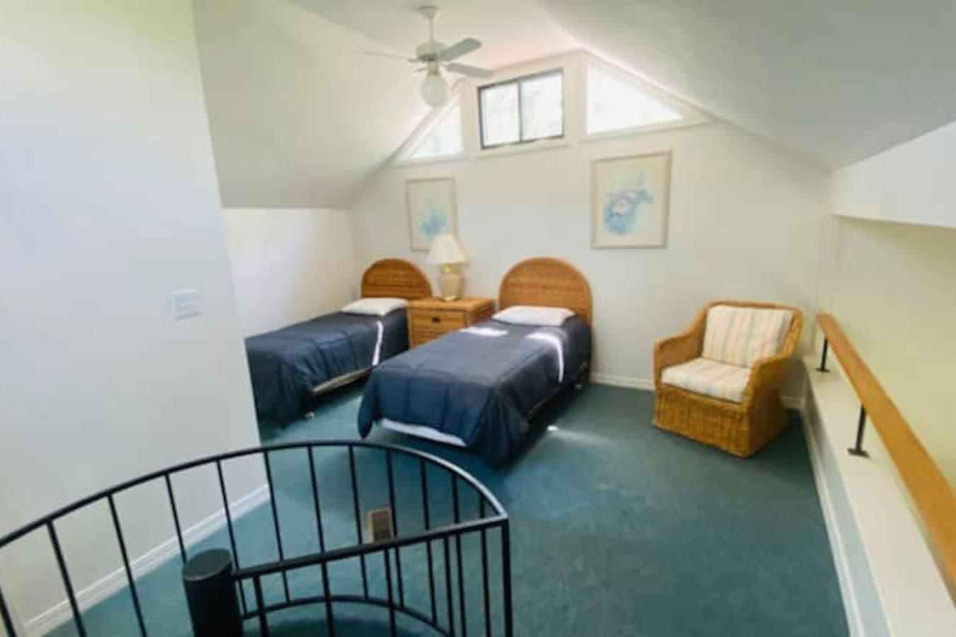 Nestled high among the trees, the upper bedrooms provide a quiet, scenic escape after lake-filled days