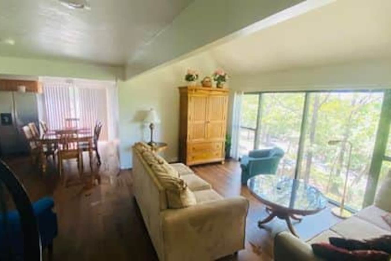 Gather with family or friends in the inviting living area of this charming treetop retreat.