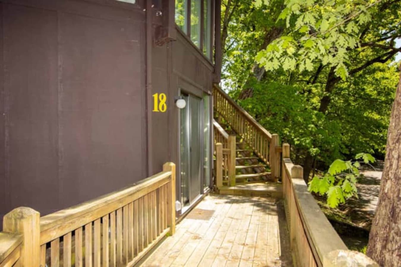 Your comfortable retreat at Treetop Village Unit 18 awaits, featuring a distinctive architectural design and easy access.