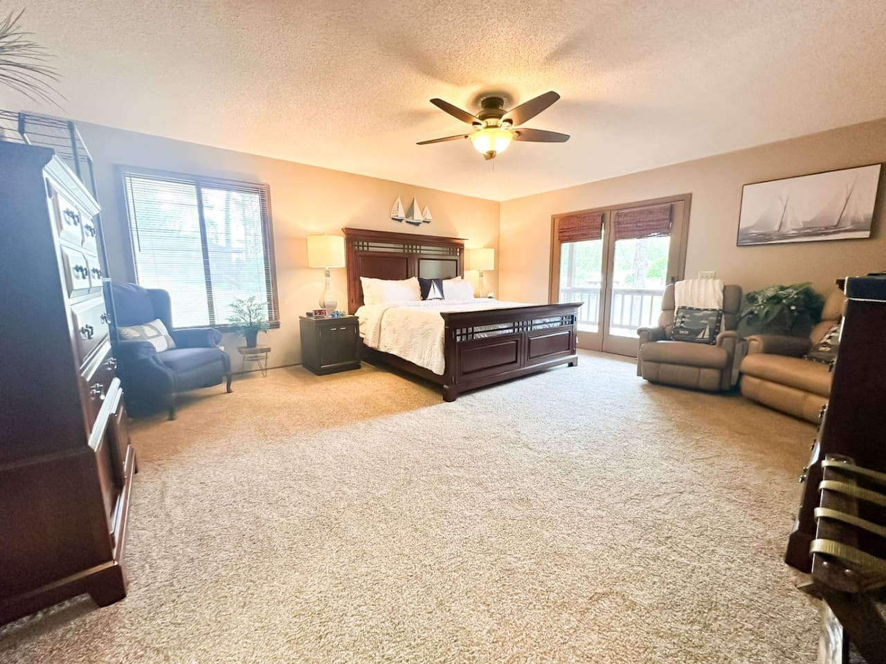 Spacious lakefront master suite with serene views and cozy charm!