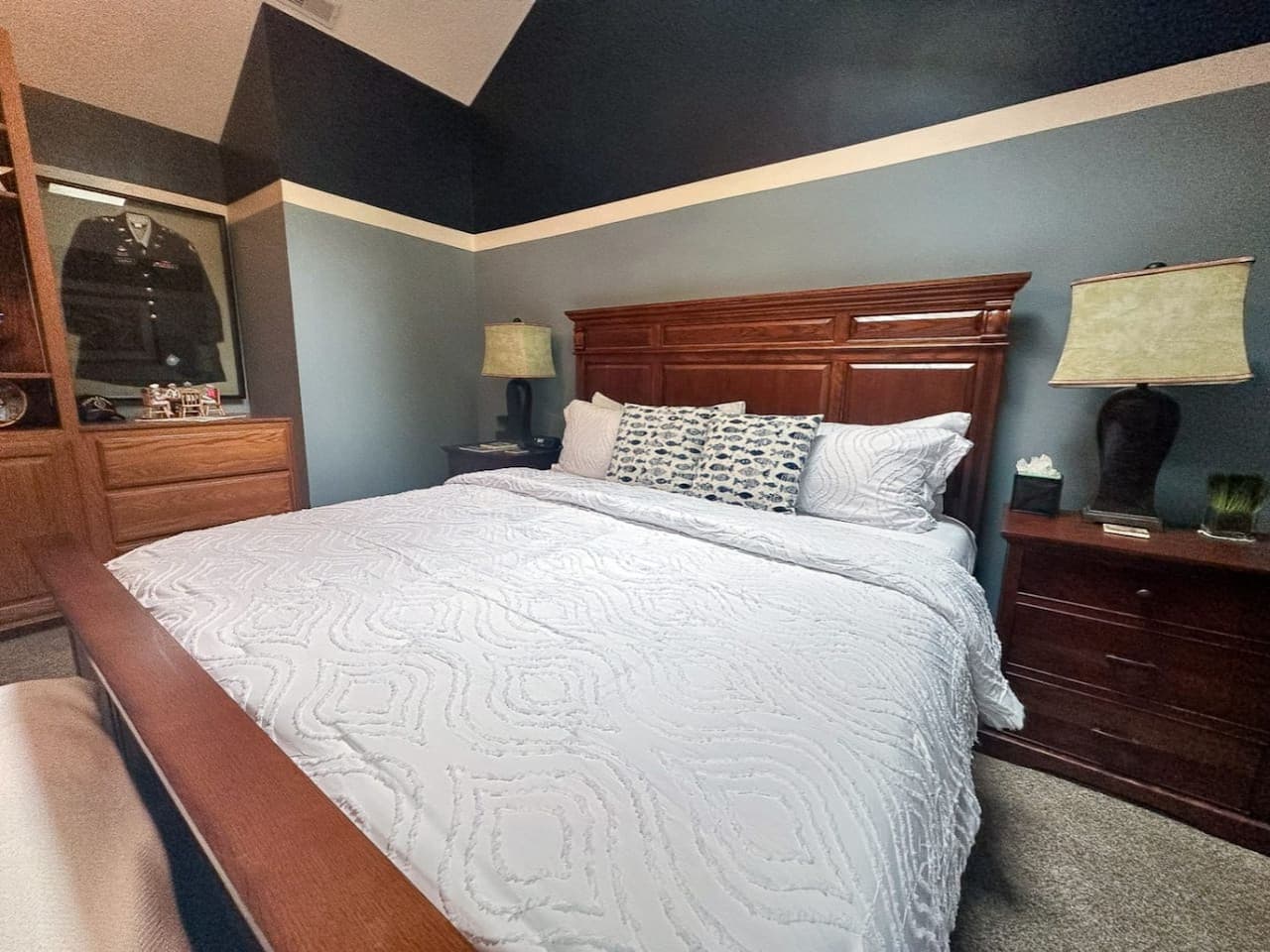 This rustic bedroom offers a warm, inviting atmosphere with natural wood accents and cozy, earthy tones. The charming, laid-back vibe makes it the perfect sanctuary to unwind and enjoy a peaceful night's sleep.