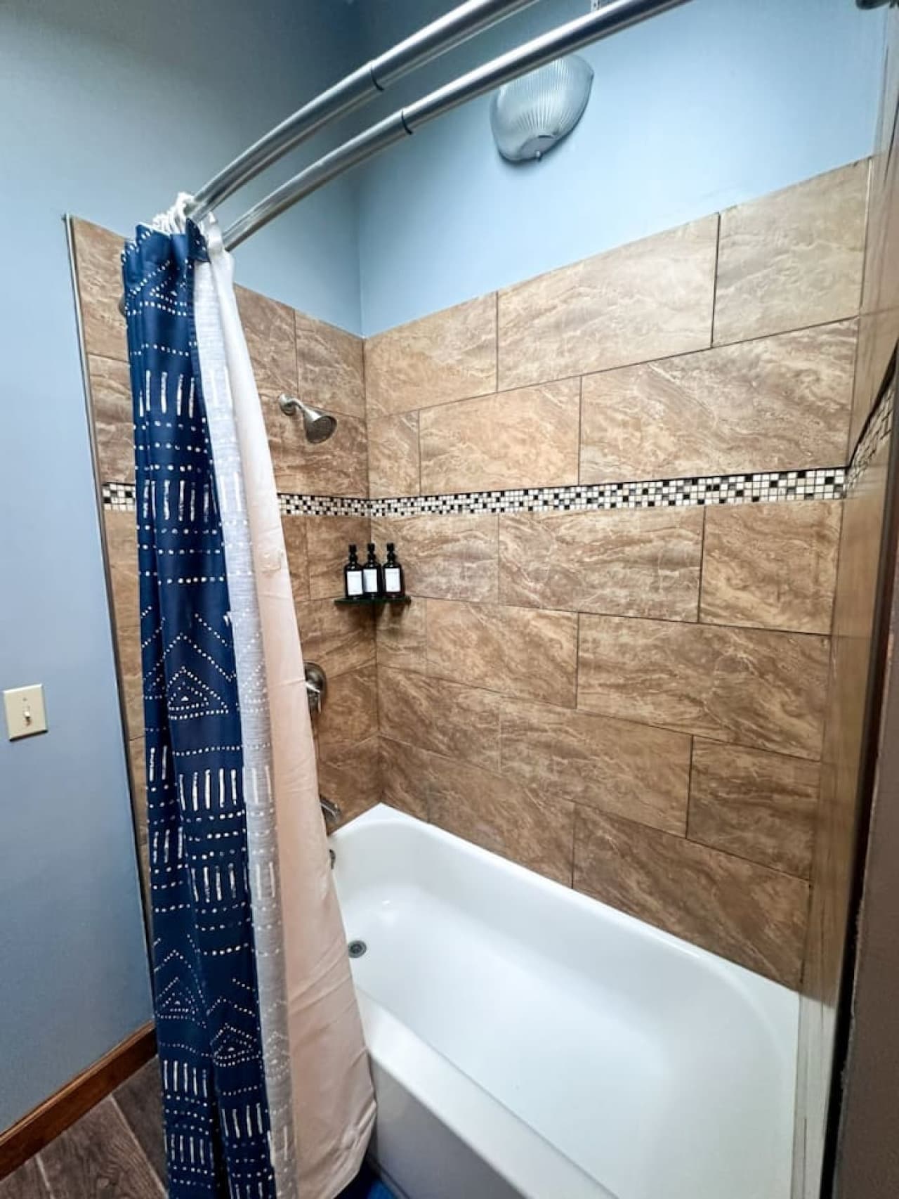 This stylish bathroom combines a spacious shower and bathtub in one seamless design, creating a relaxing retreat with plenty of room to unwind. Modern fixtures and a clean, open layout make it the perfect spot to enjoy both a quick shower and a long,