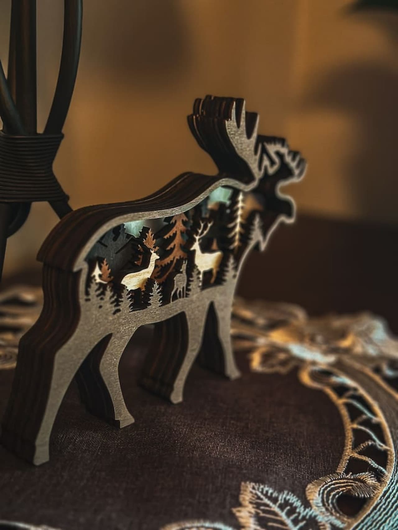 This stylish space boasts a chic deer decor that adds a touch of elegance and nature-inspired charm to the room. The sleek design of the piece perfectly complements the modern yet earthy feel of the space, creating a unique focal point.