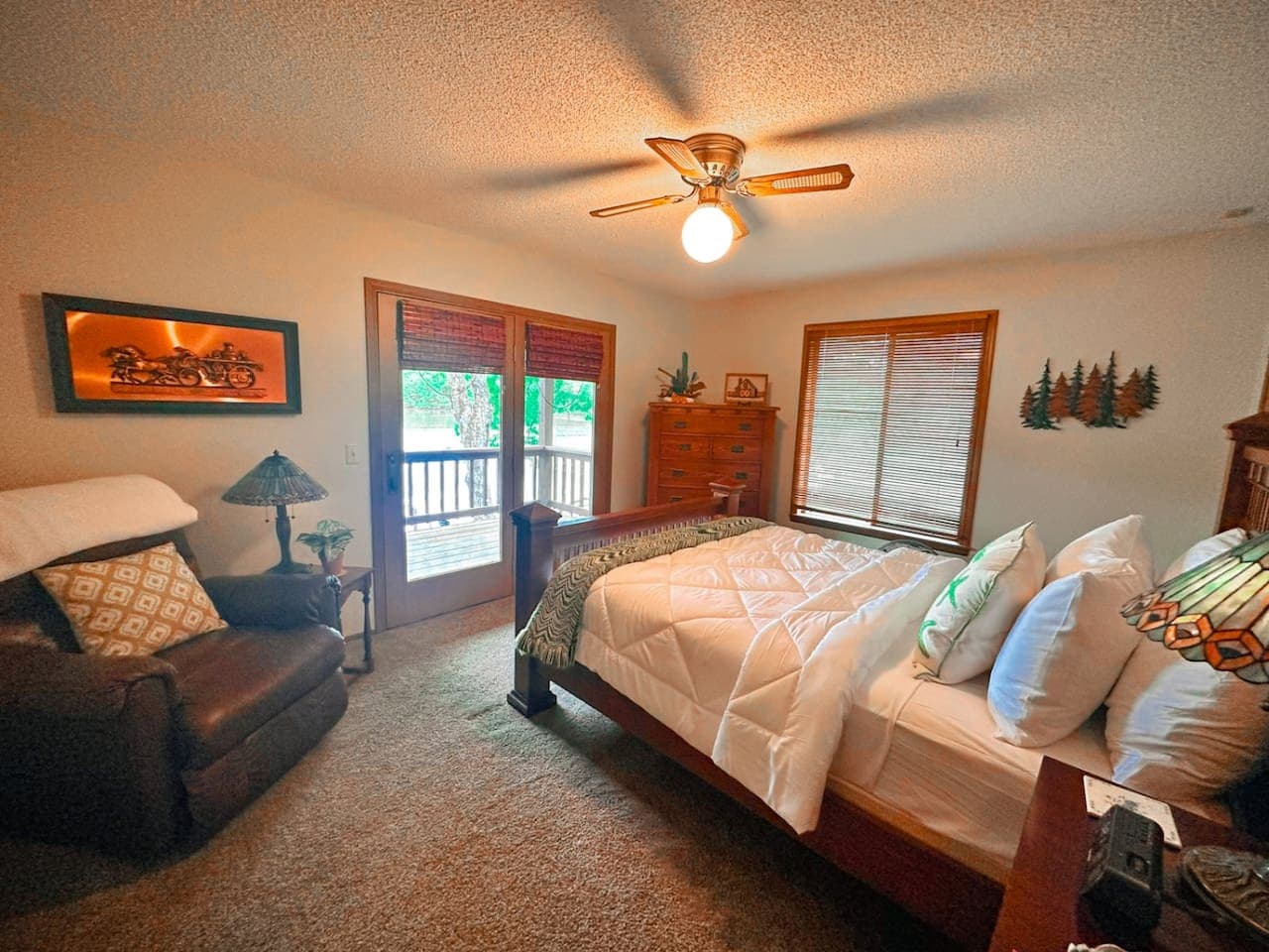 Lake views and cozy comfort await in our queen bedroom.