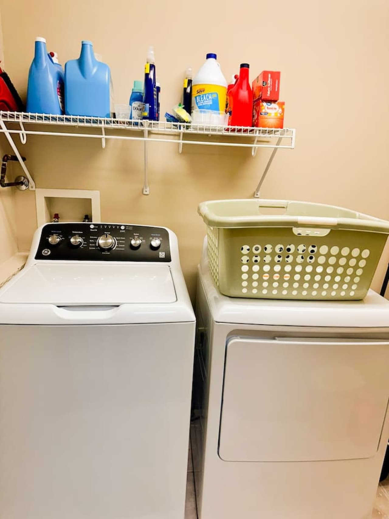 This convenient laundry area is stocked with a variety of detergents, ensuring you have the perfect option for every load. Thoughtfully designed for efficiency, it makes laundry day a breeze while keeping everything organized and accessible.