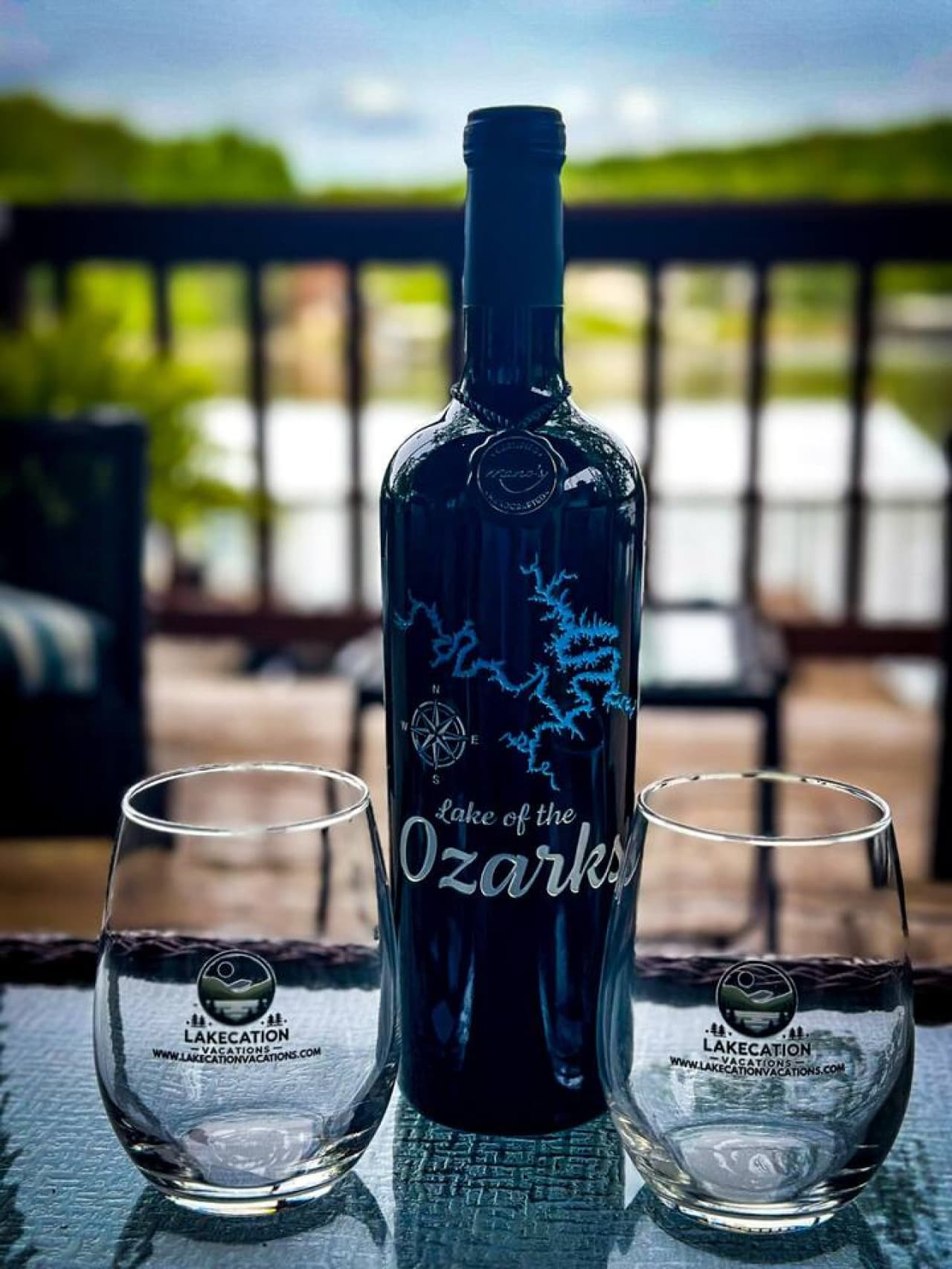 Unwind by the serene waters of Lake of the Ozarks, glass of local wine in hand where relaxation meets breathtaking views.