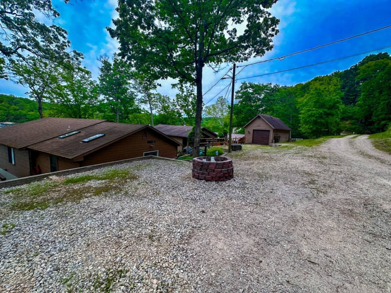 Gather around the lakeside firepit and take in stunning waterfront views right from your backyard—perfect for cozy evenings under the stars. This charming lakefront home offers the ideal mix of comfort and outdoor living, with nature’s beauty just be