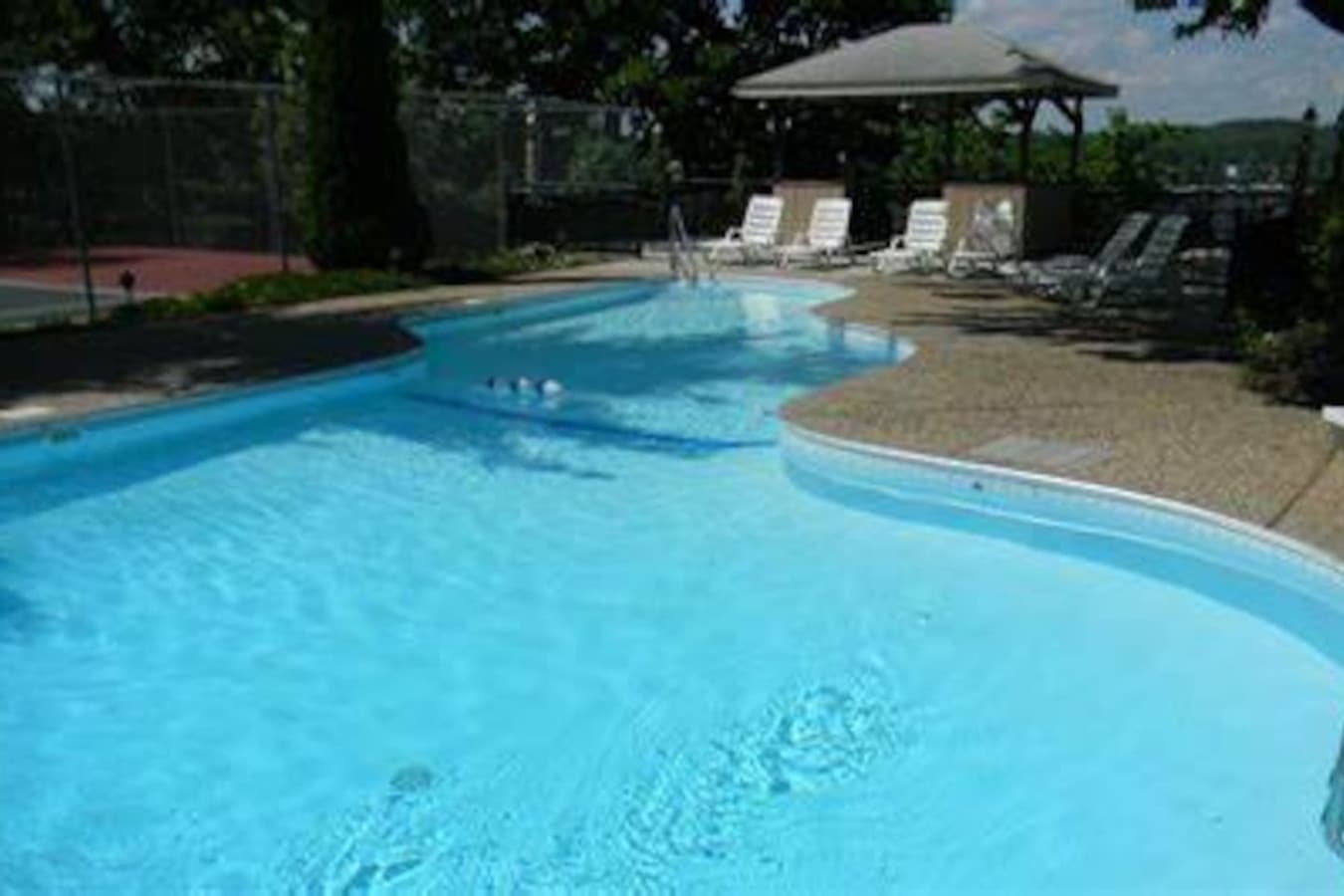 Cool off at the community pool, just steps from your lakefront condo — perfect for families and summer fun.