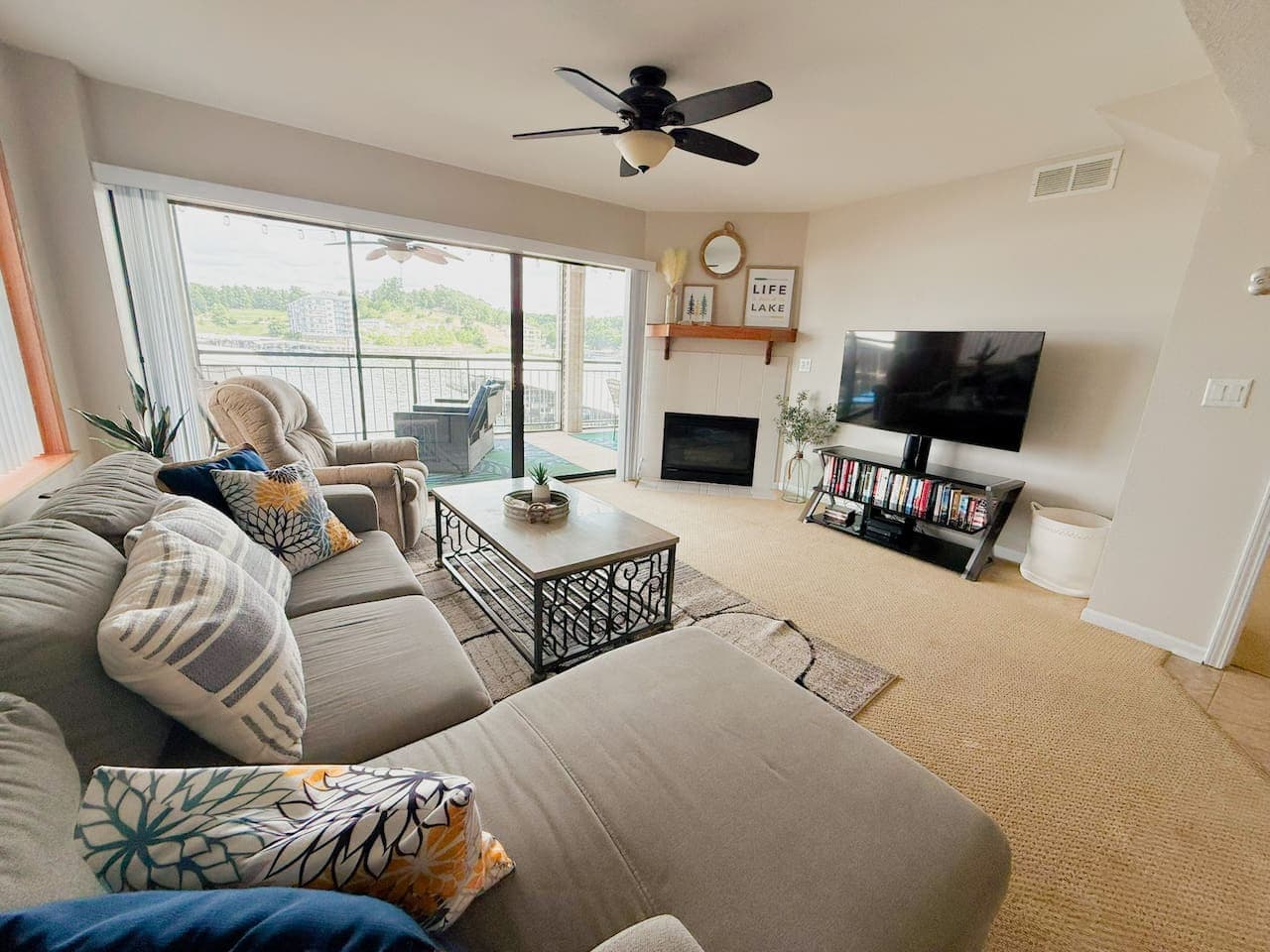 Seamless indoor-outdoor living from the comfort of your vacation rental. Enjoy the lake breeze from the living room or balcony