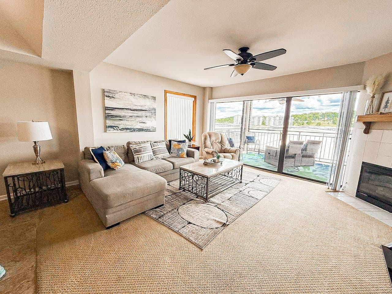 Spacious living area with incredible lake views at our comfortable condo, perfect for your next getaway.