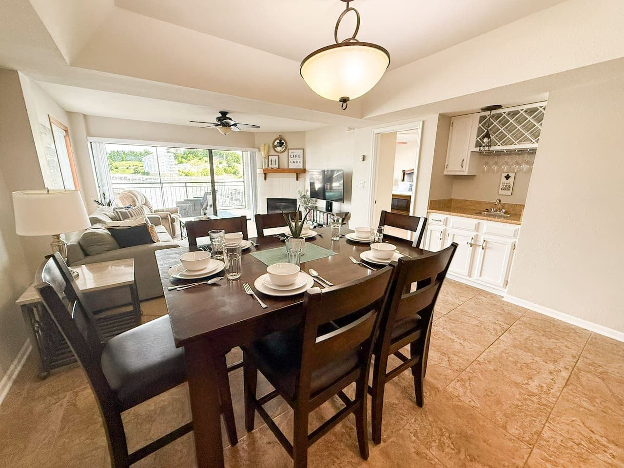 Enjoy meals with a view in this open-concept dining and living area, complete with a convenient wet bar.