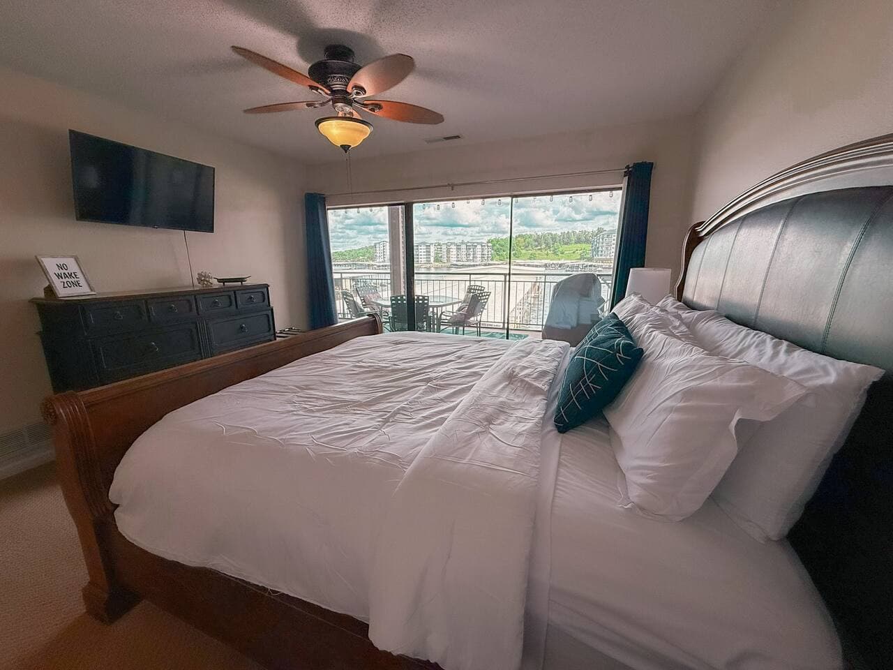 Unwind in this spacious bedroom, perfectly positioned for enjoying the beautiful outdoor scenery right from your bed.