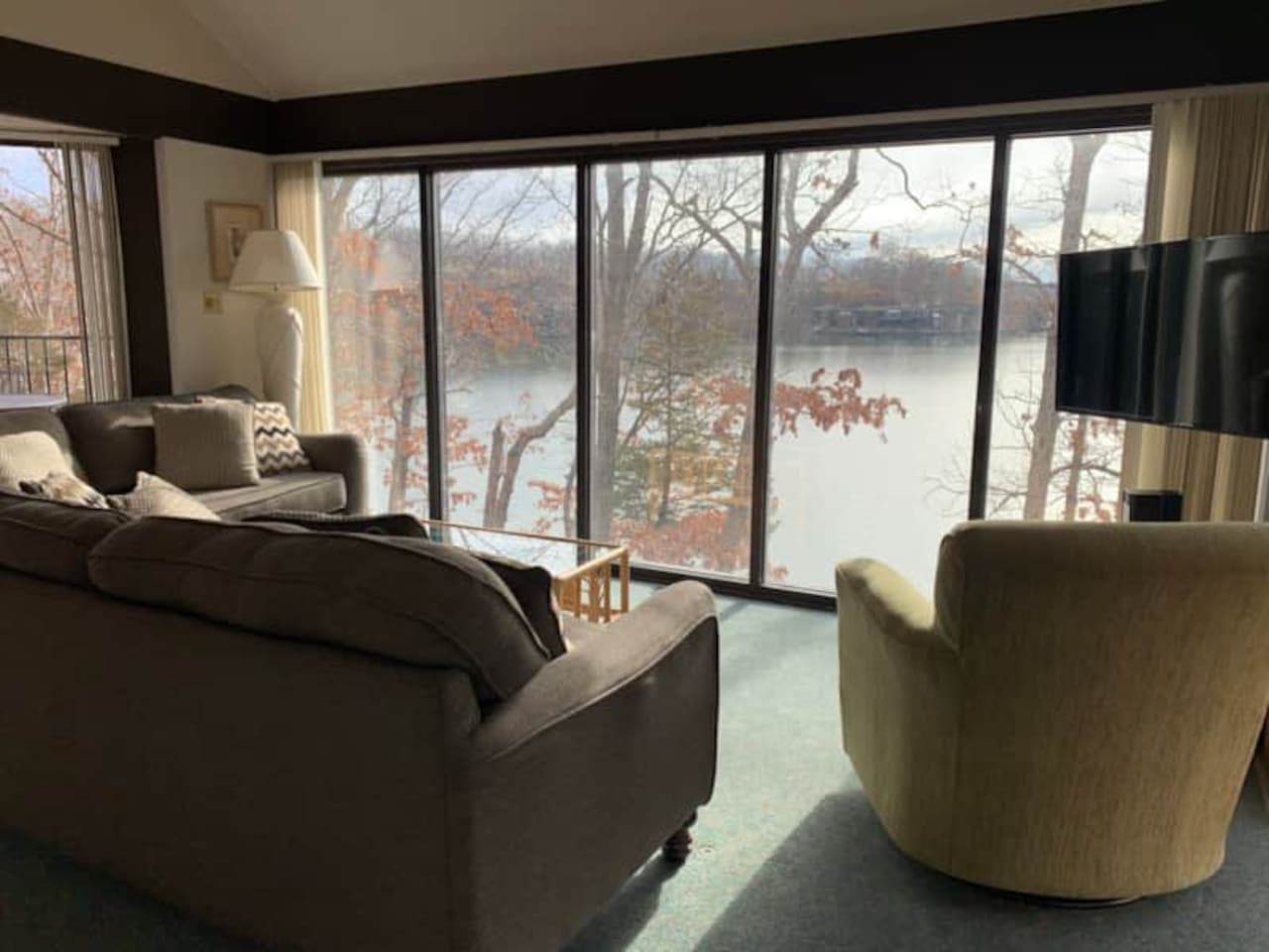 Your private panoramic view of the lake! Cozy up in this inviting living room and watch the seasons change right outside your window.