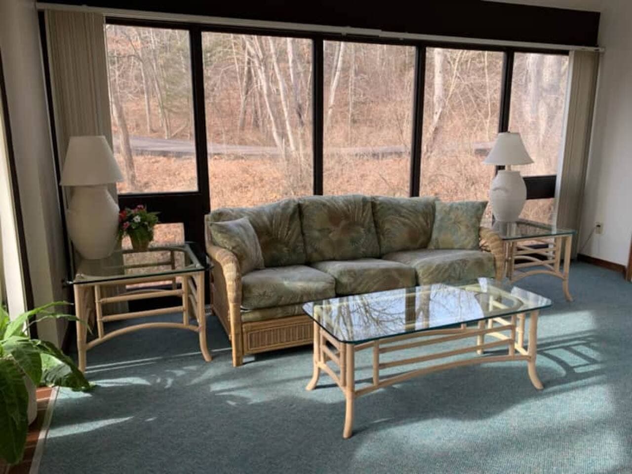 Soak up the sun and enjoy the tranquil views from this inviting living area, surrounded by nature.